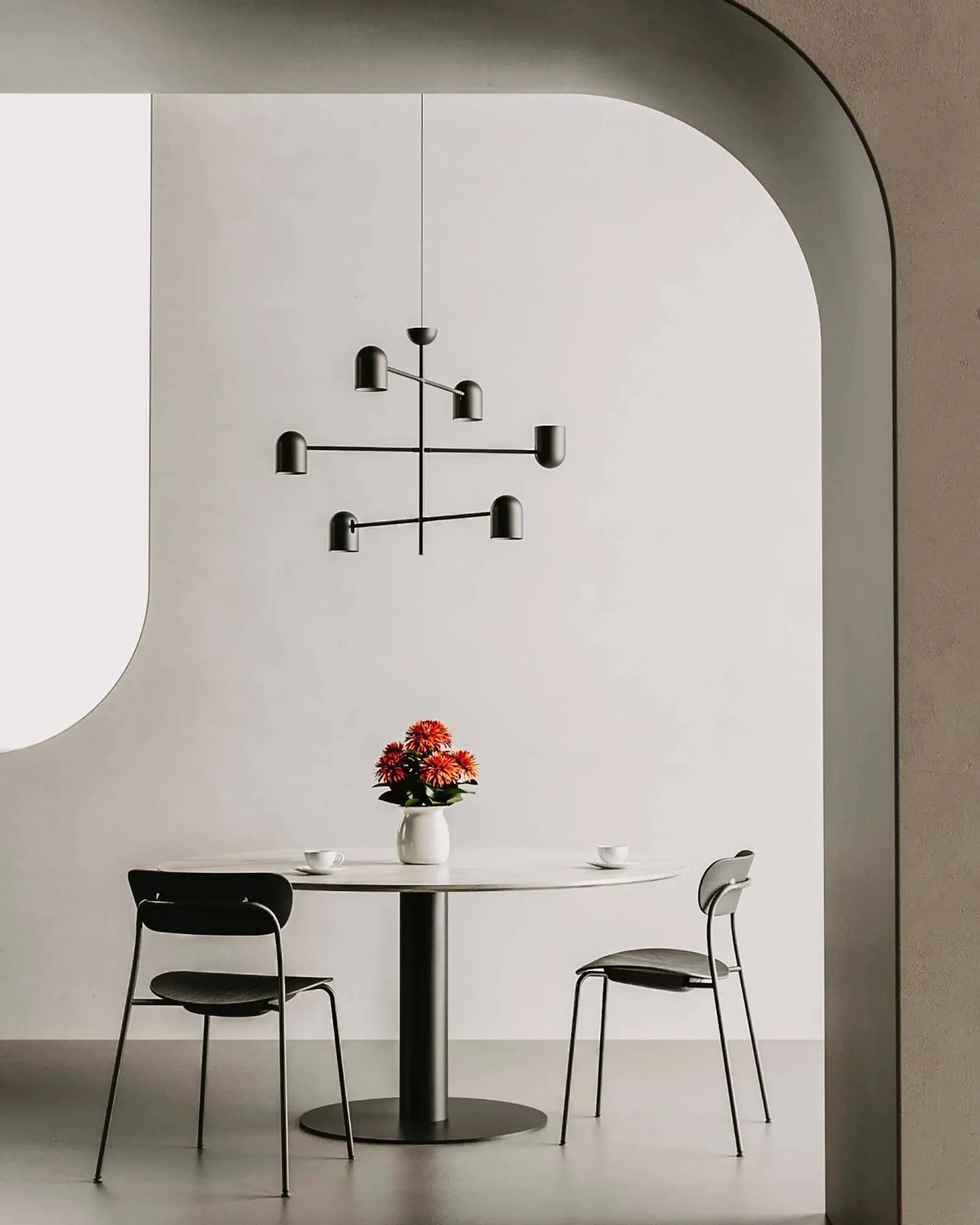 Pipe modern matte black 6 lights pendant light above a round dining table