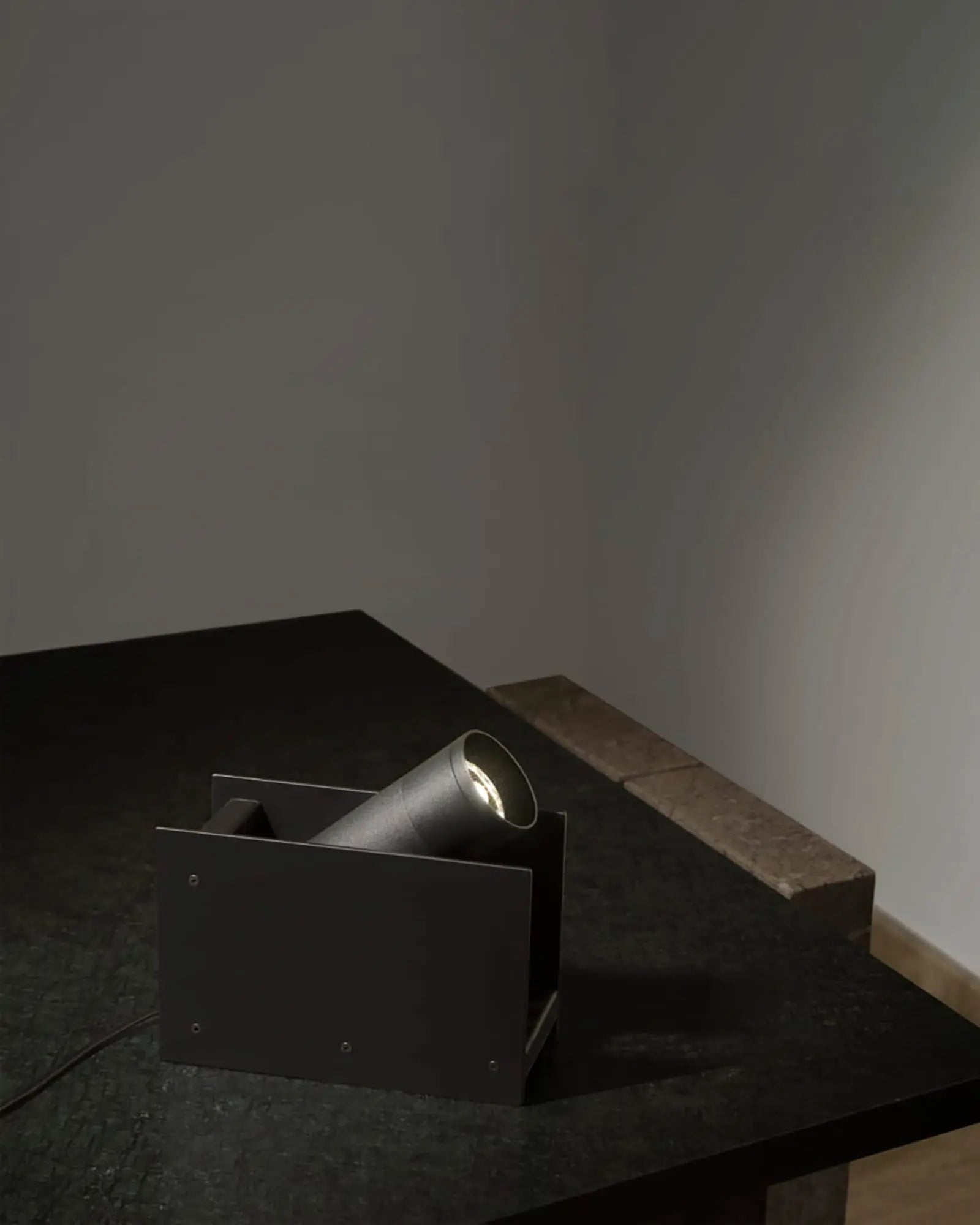Plint adjustable minimal rectangular floor lamp on a table