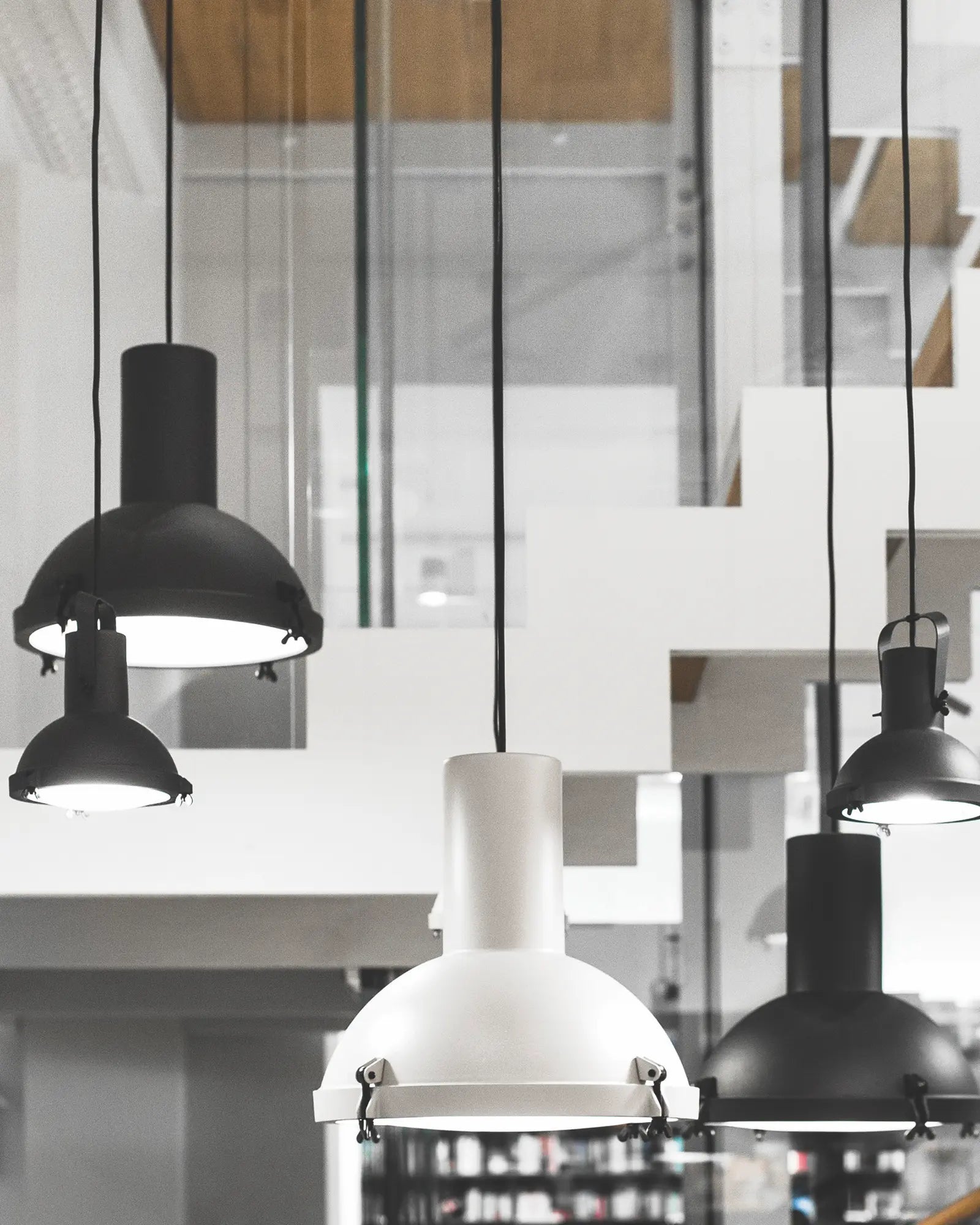 Projecteur classic iconic pendant light cluster in a staircase
