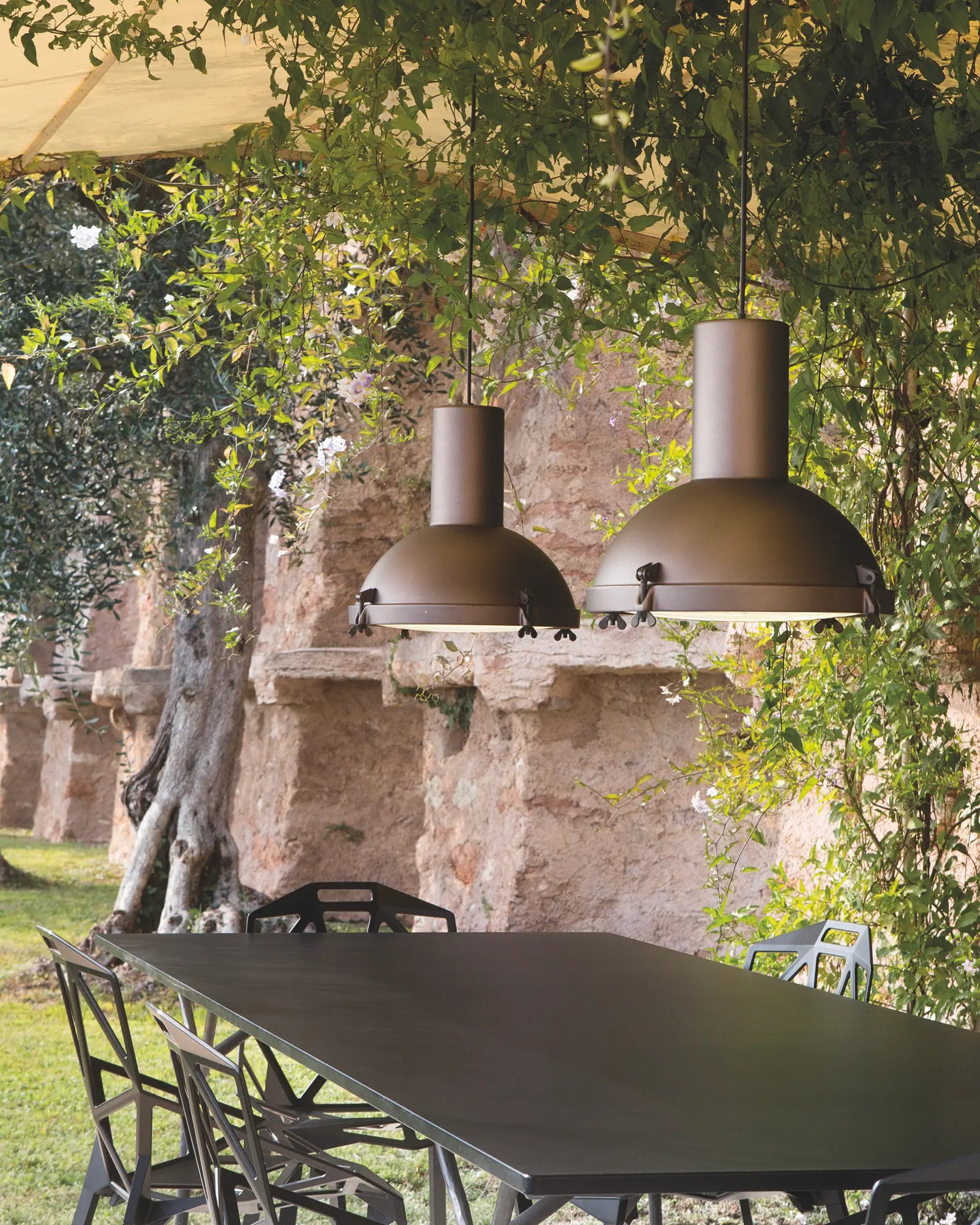Projecteur classic iconic pendant light cluster above an outdoor table