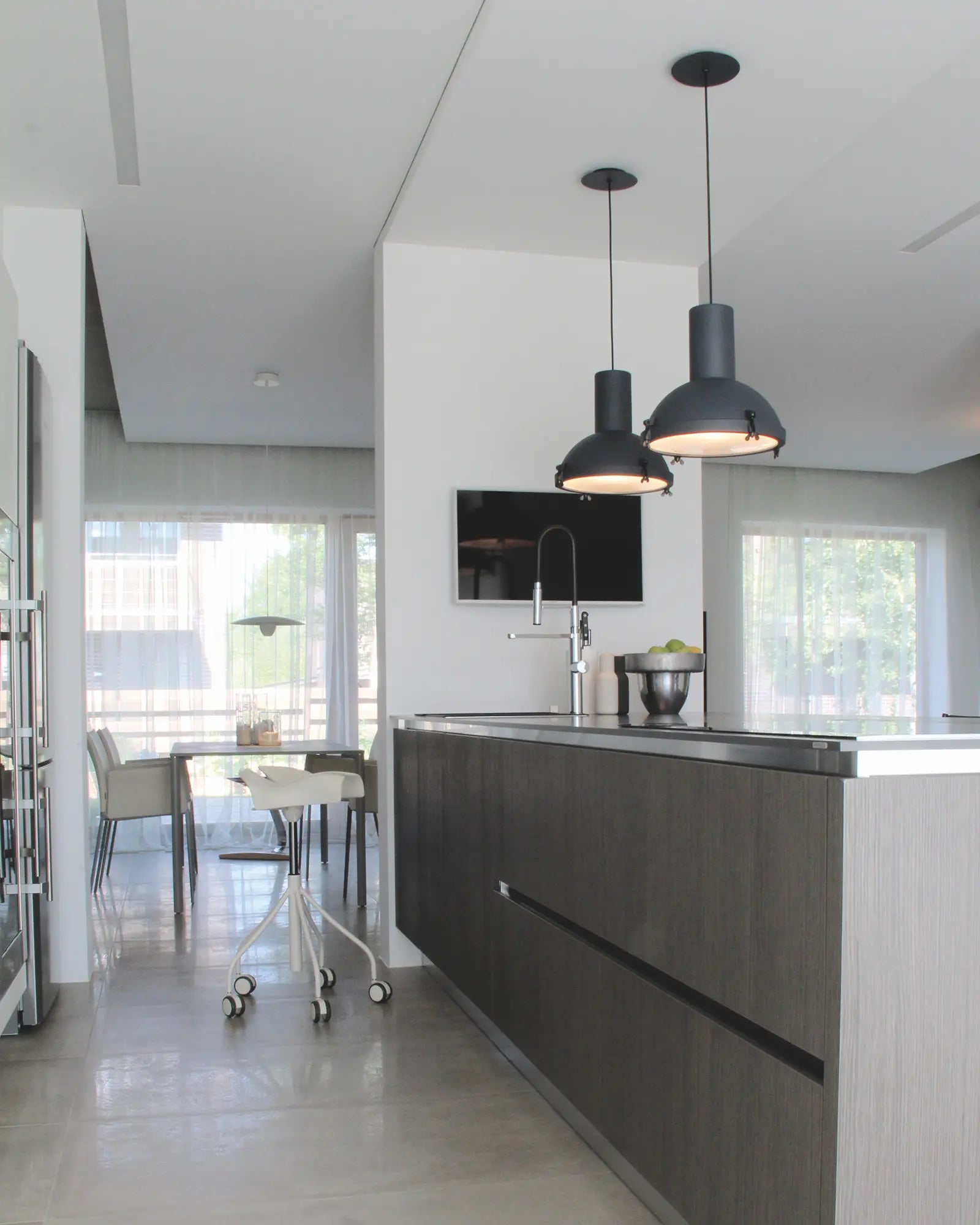 Projecteur classic iconic pendant light cluster above a kitchen island