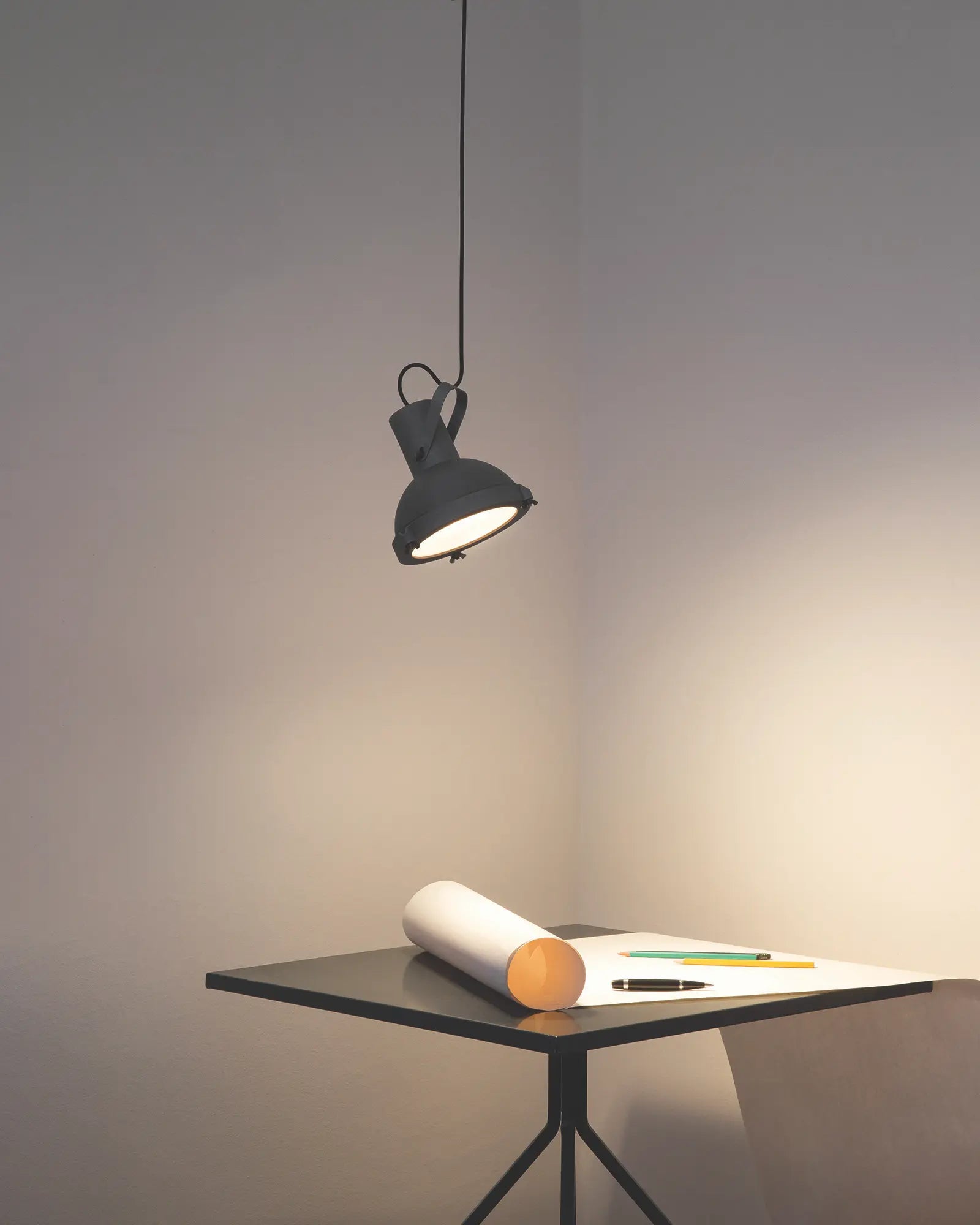 Projecteur classic iconic pendant light over a coffee table