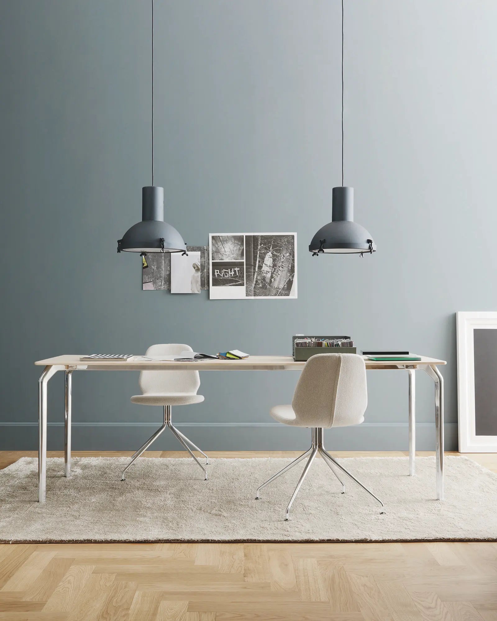 Projecteur classic iconic pendant light cluster above a meeting table