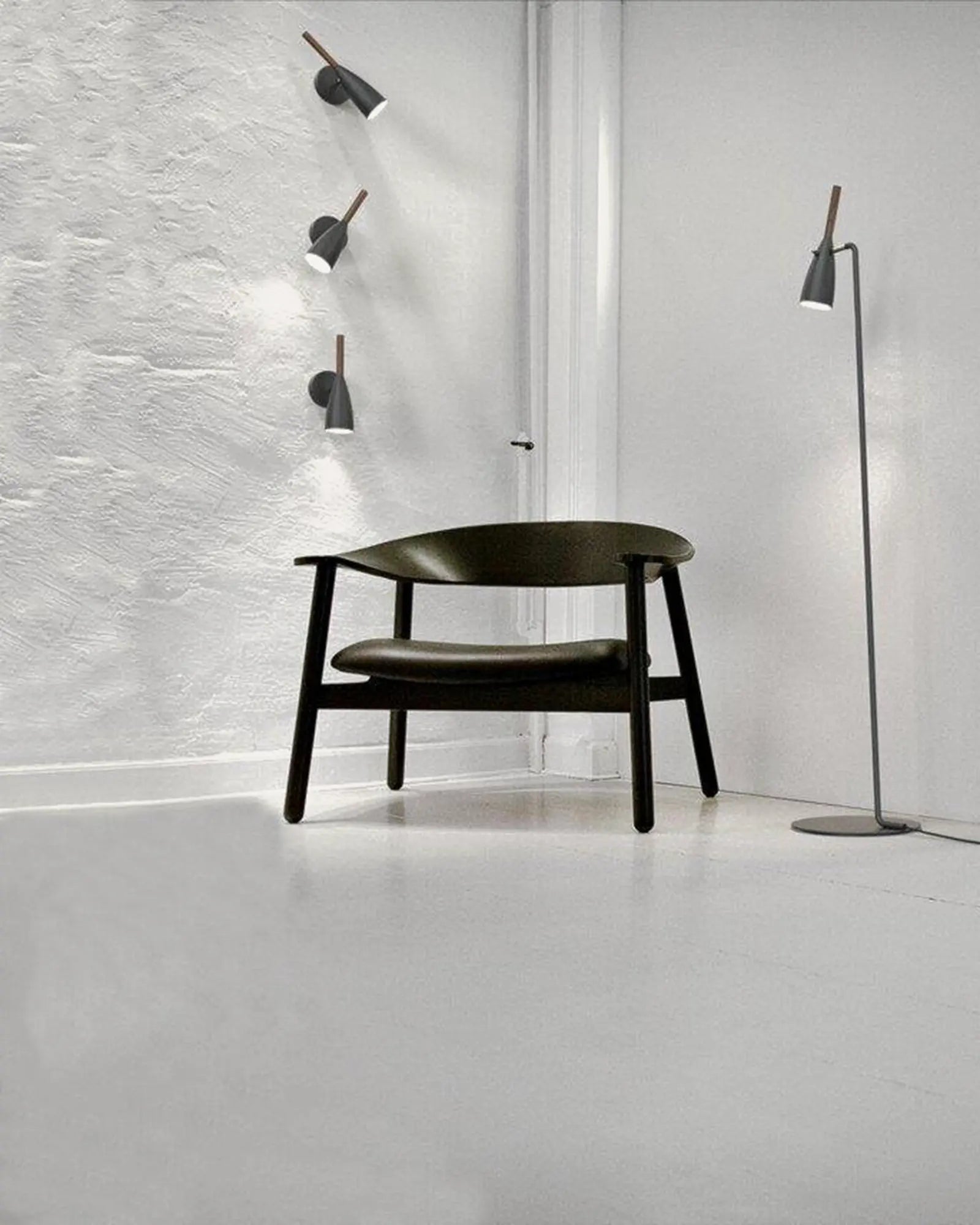 Pure Scandinavian metal and timber contemporary wall light cluster in a living area