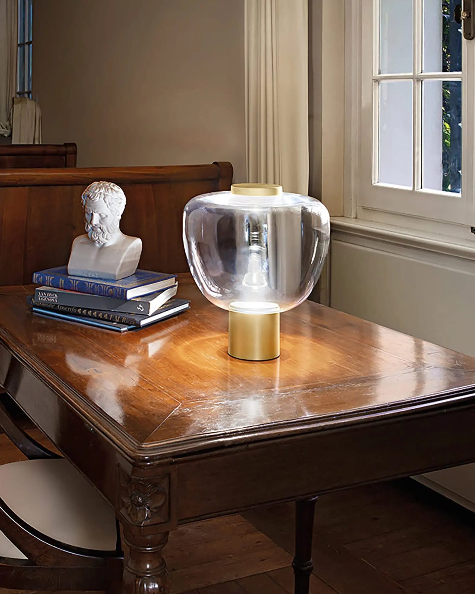Rflesso Murano blwon glass and metal table lamp on a desk