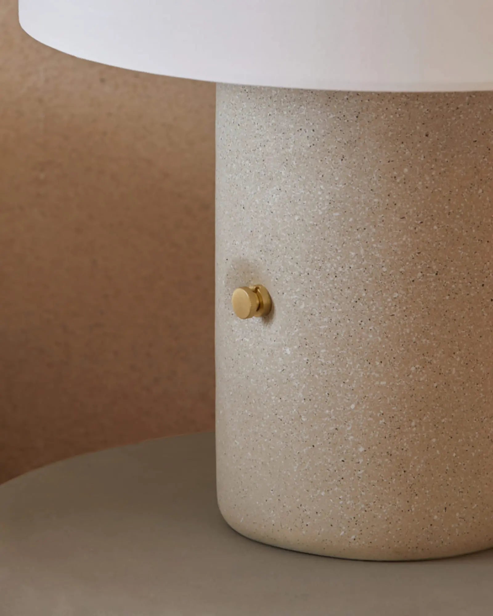 Sand Terrazzo and fabric shade portable table lamp with brass details