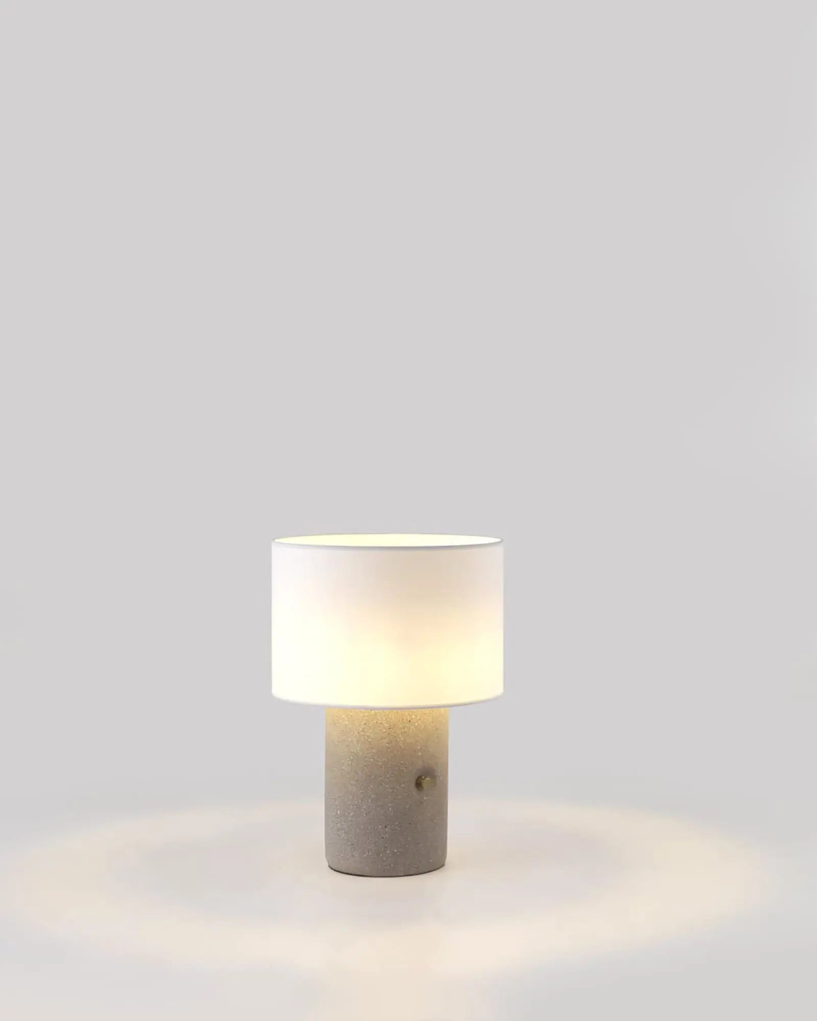 Sand Terrazzo and fabric shade portable table lamp with brass details product photo