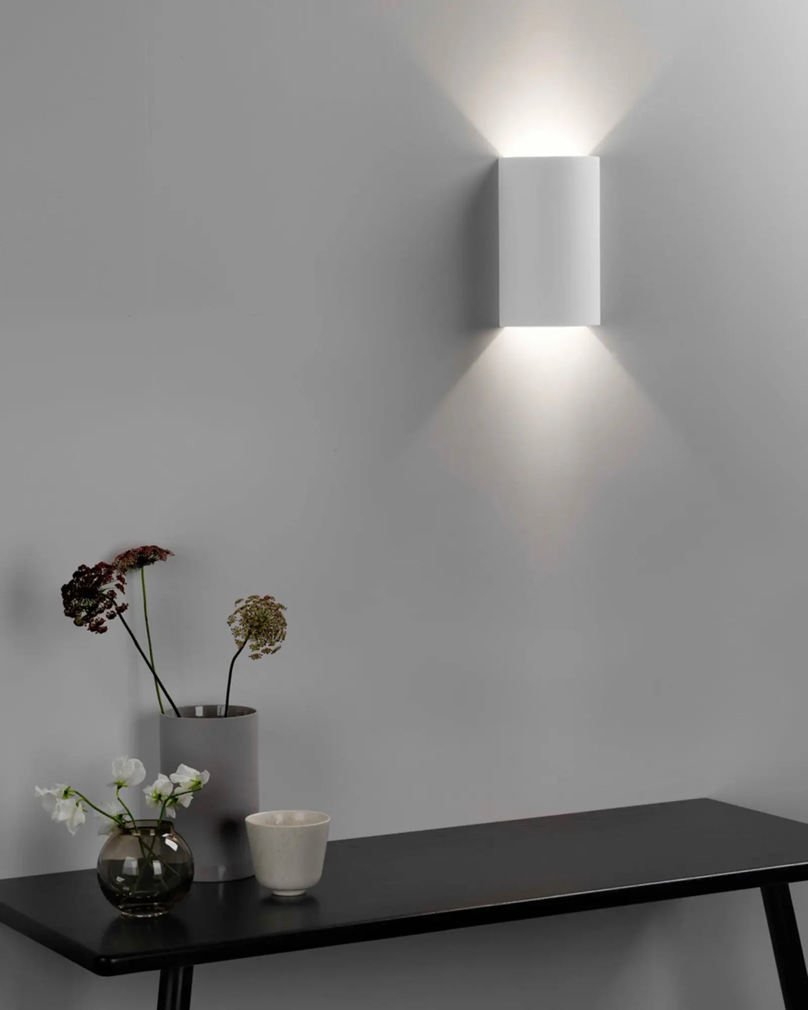 Serifos contemporary plaster curved wall light above a coffee table