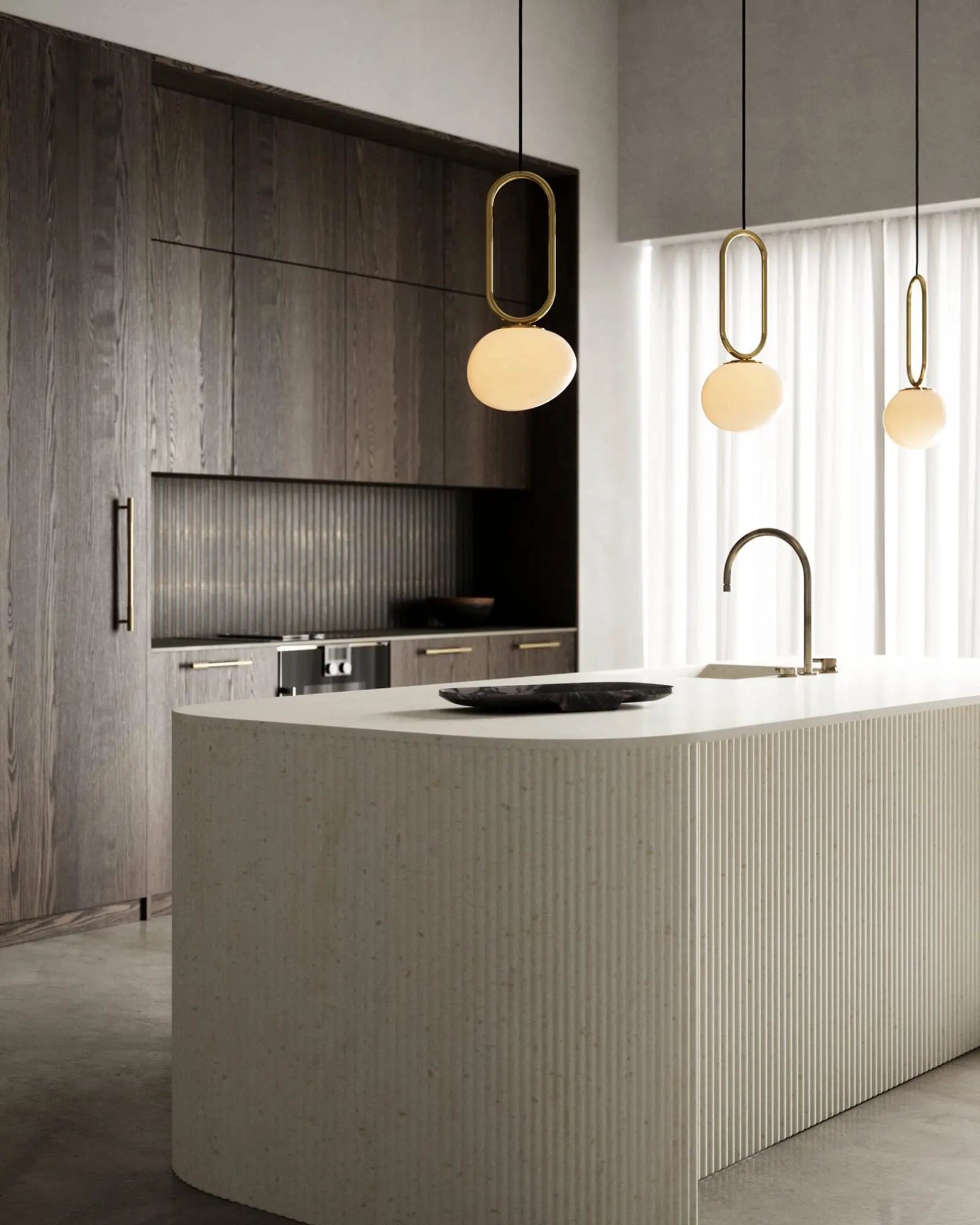 Shape brass and opal glass pendant light above a kitchen island