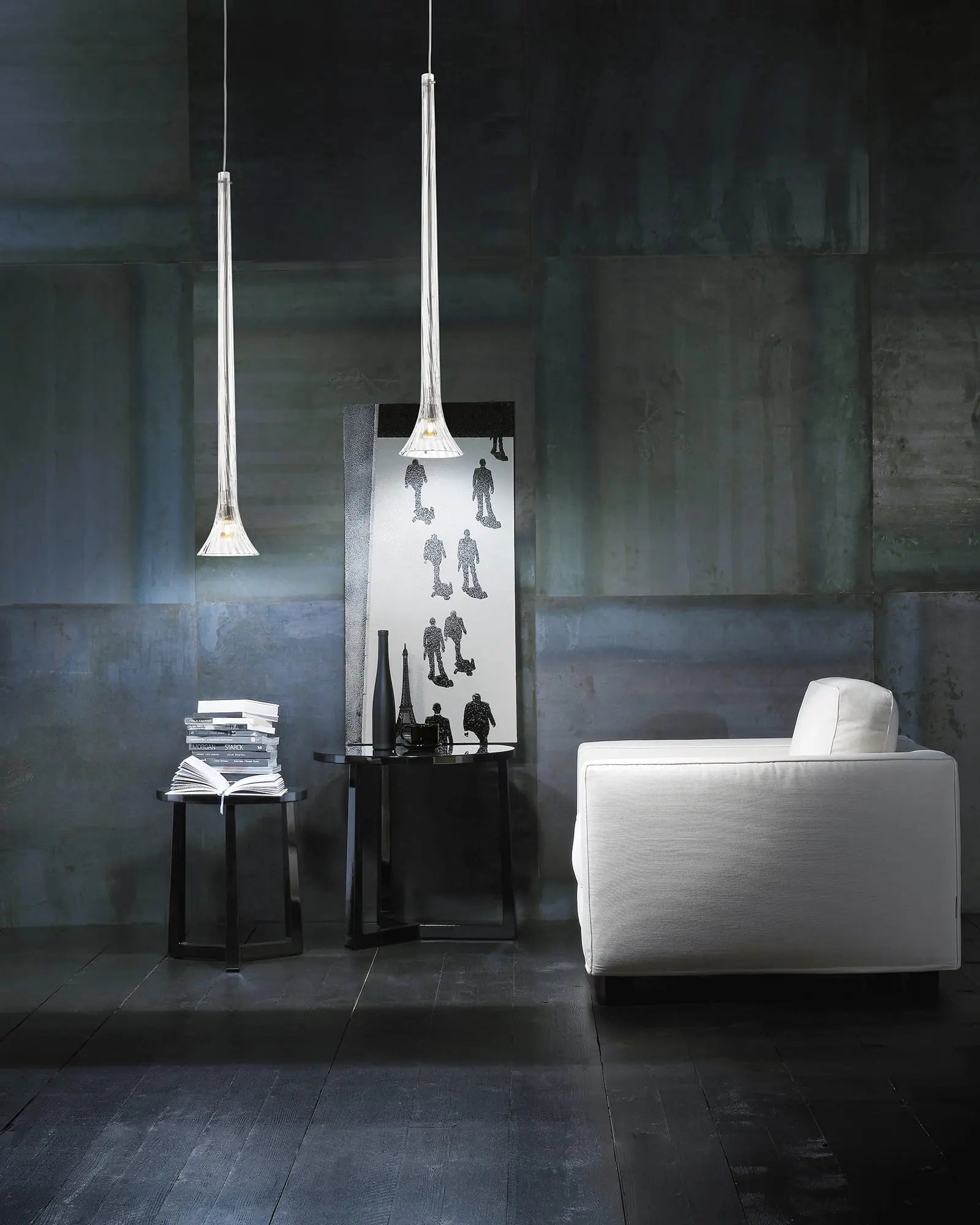 Sissi elongated cone blown glass pendant light cluster on a coffee table in a living area