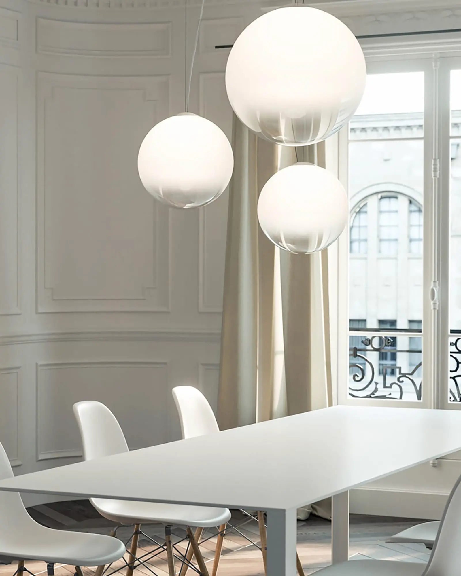 Smoke blown glass pendant light cluster above table