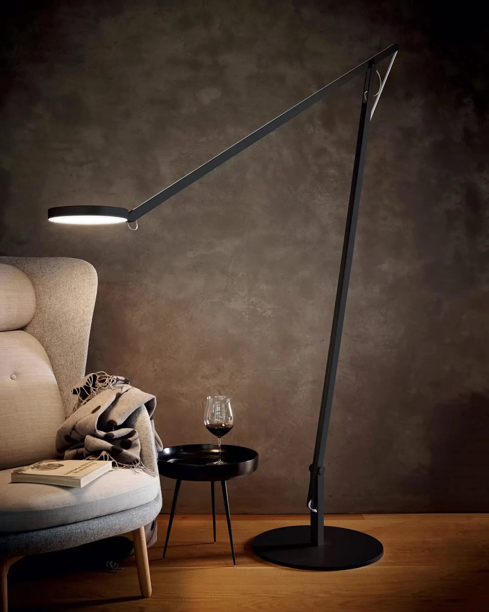 String adjustable contemporary floor lamp reading on a the couch side