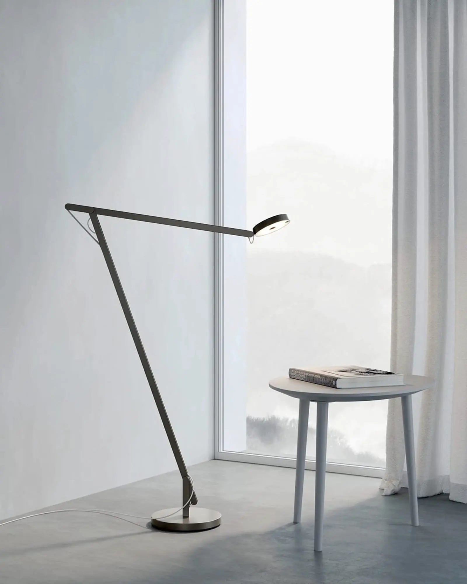String adjustable contemporary floor lamp above coffee table