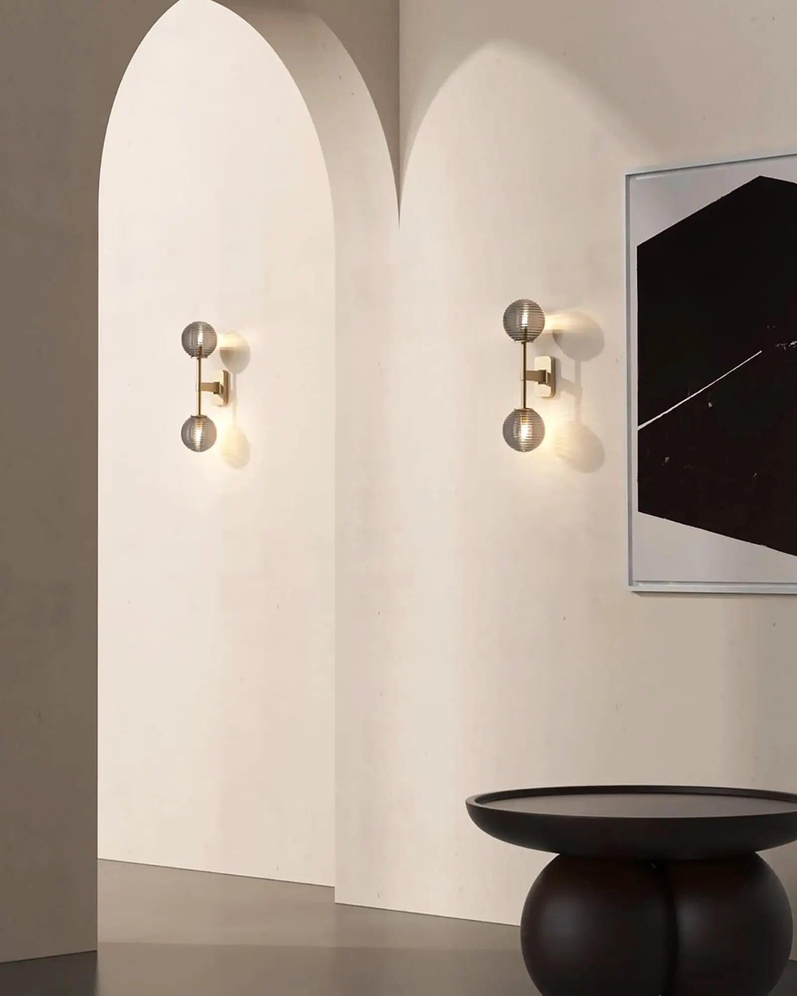 Tacoma twin classic double orb wall light in a hallway under an arch