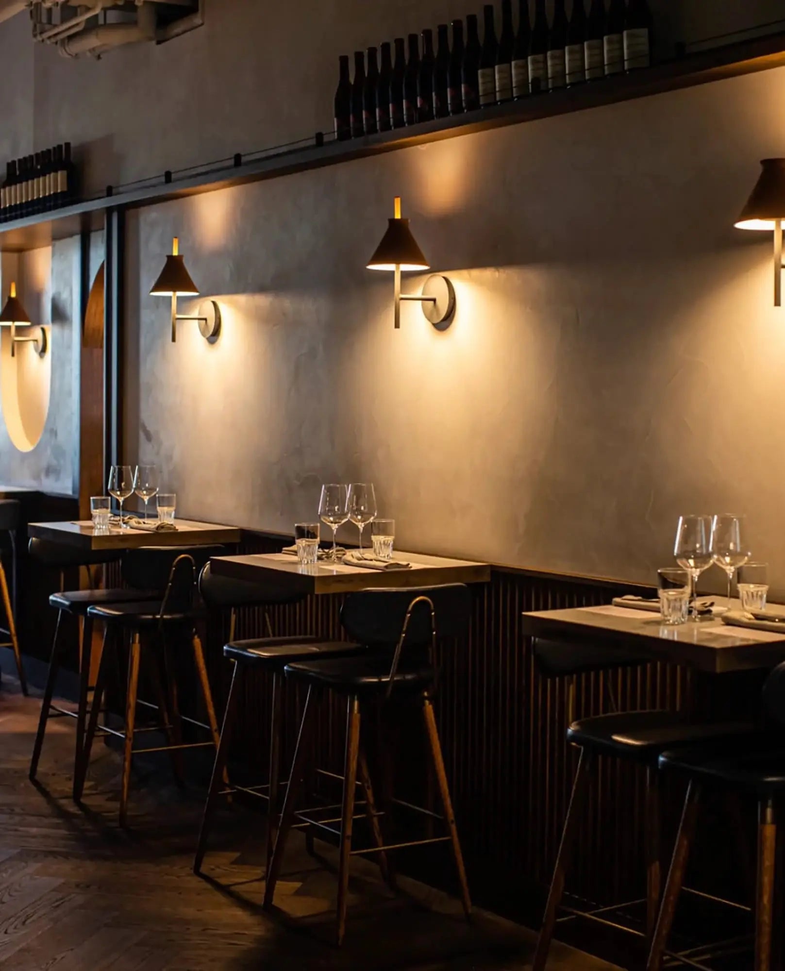 Totana Wall Light cluster above tables in a restaurant