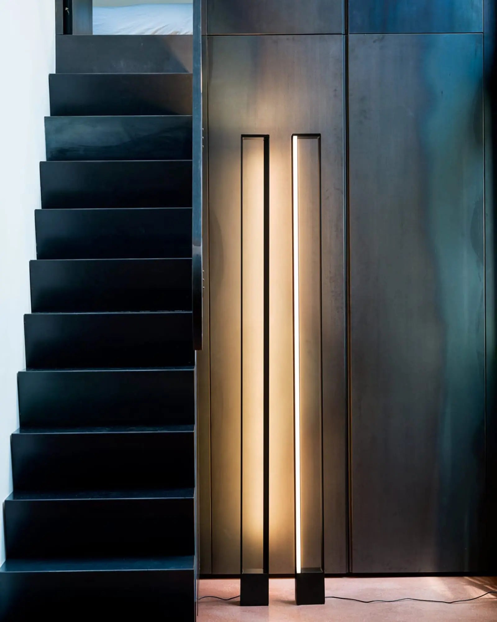 Tru modern minimal rectangular frame tall floor lamp near a staircase
