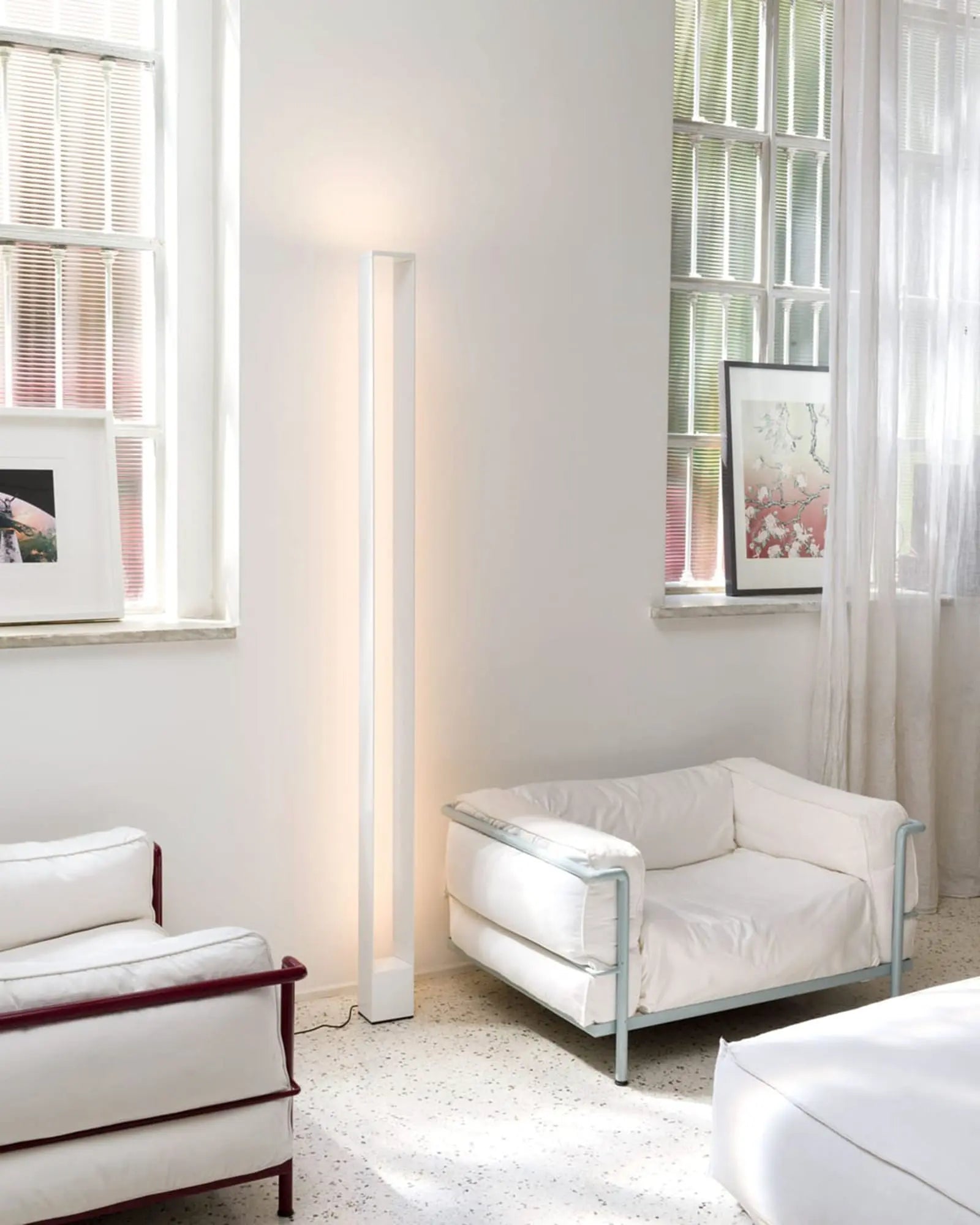 Tru modern minimal rectangular frame tall floor lamp in a lounge area
