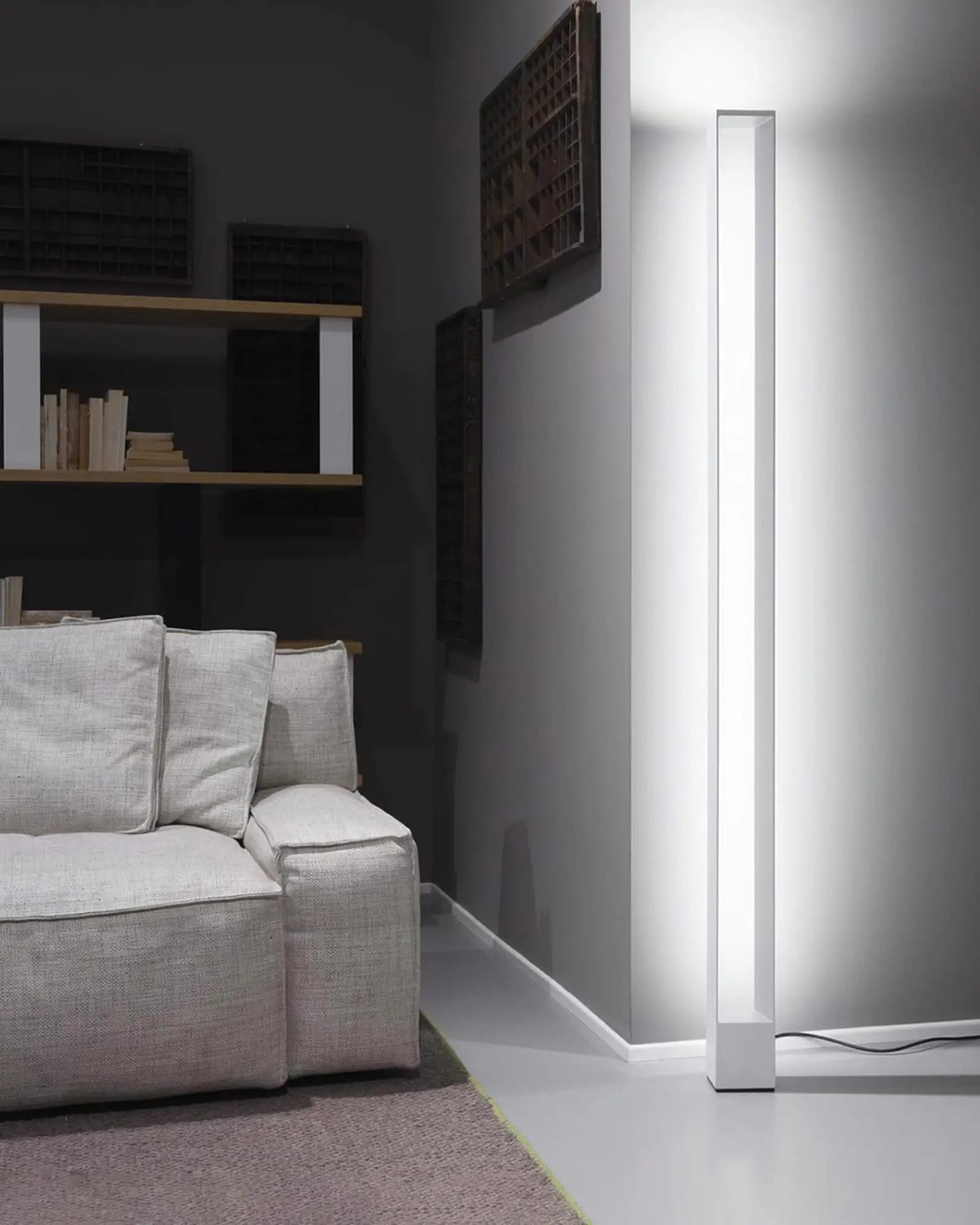 Tru modern minimal rectangular frame tall floor lamp near a sofa