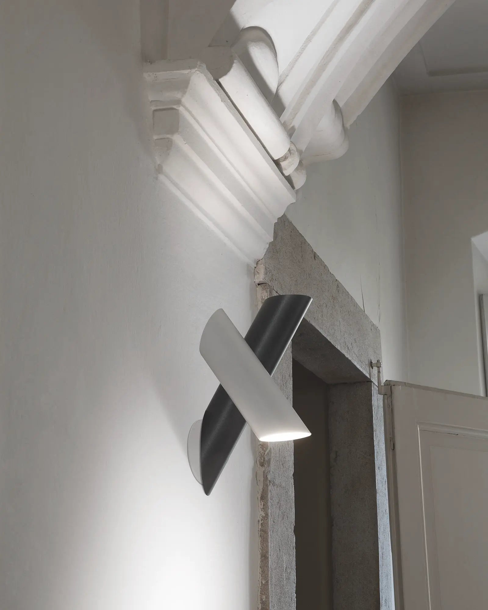 Tubes minimal cylinder wall light adjustable near door under arch