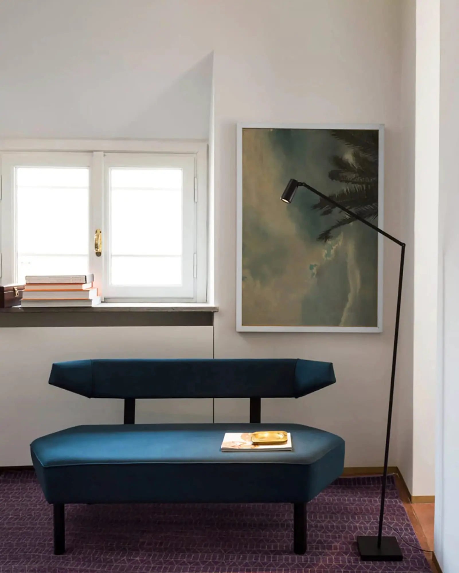Untitled thin minimal floor lamp spotlight head above a sofa
