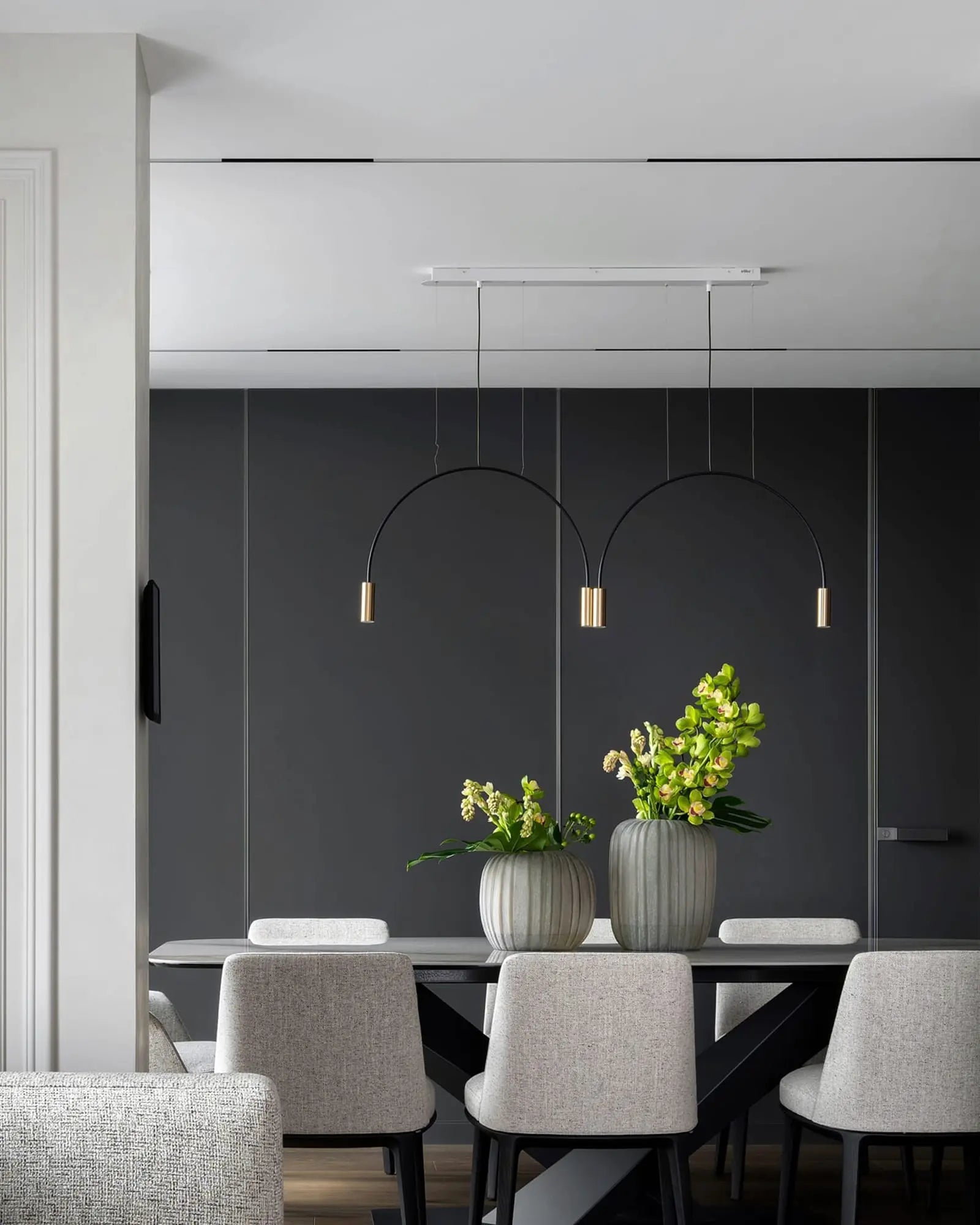 Volta Linear pendant light by Estiluz Lighting above a table