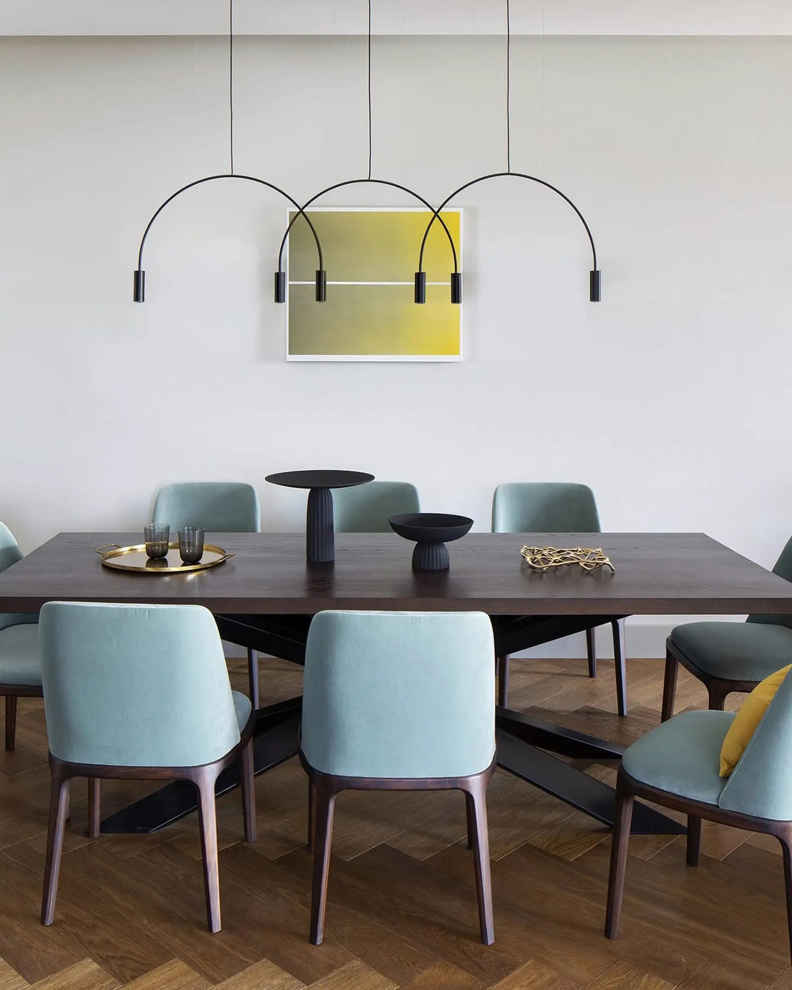 Volta Linear pendant light by Estiluz Lighting above a table