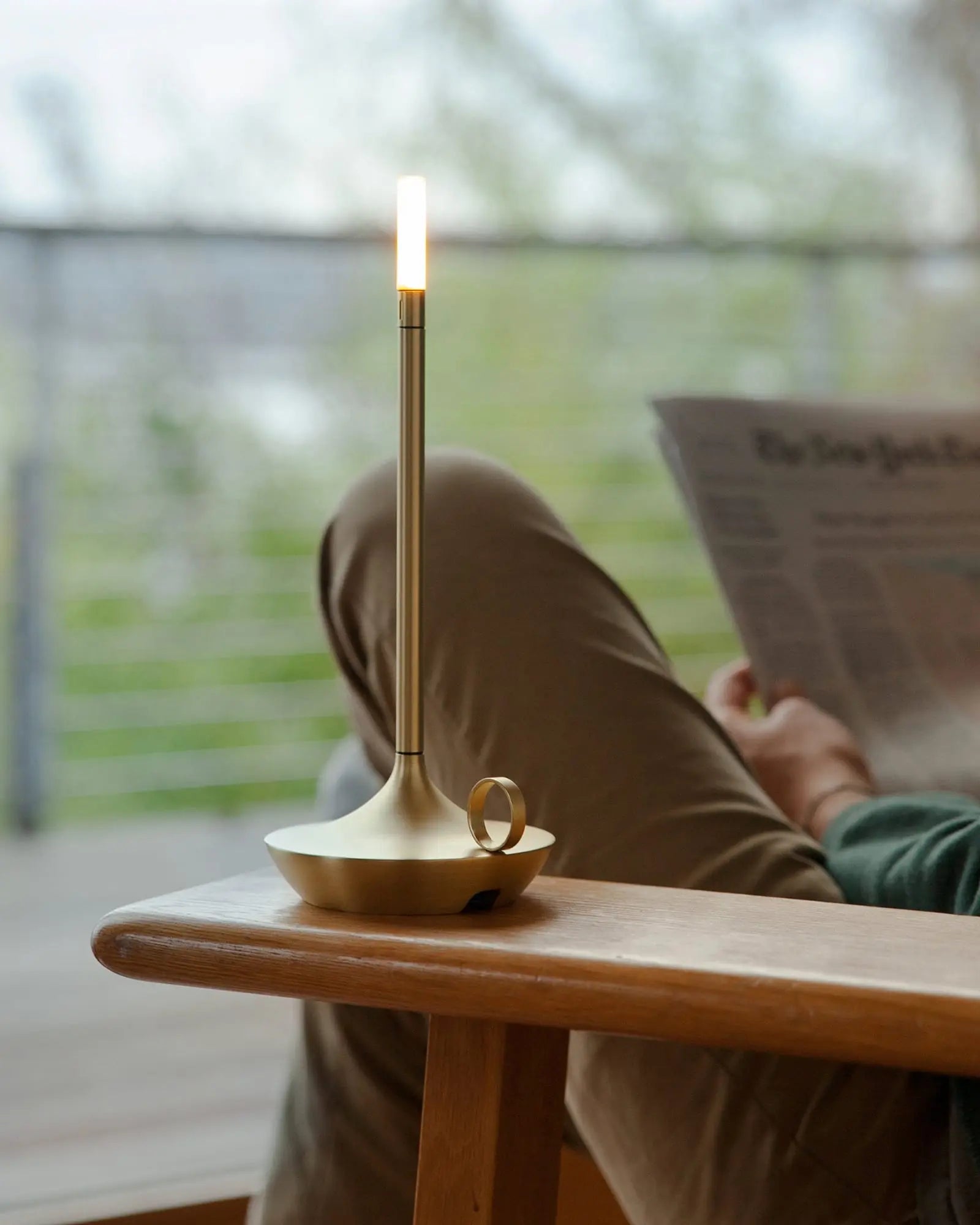 Wick Table lamp on a chair's armrest