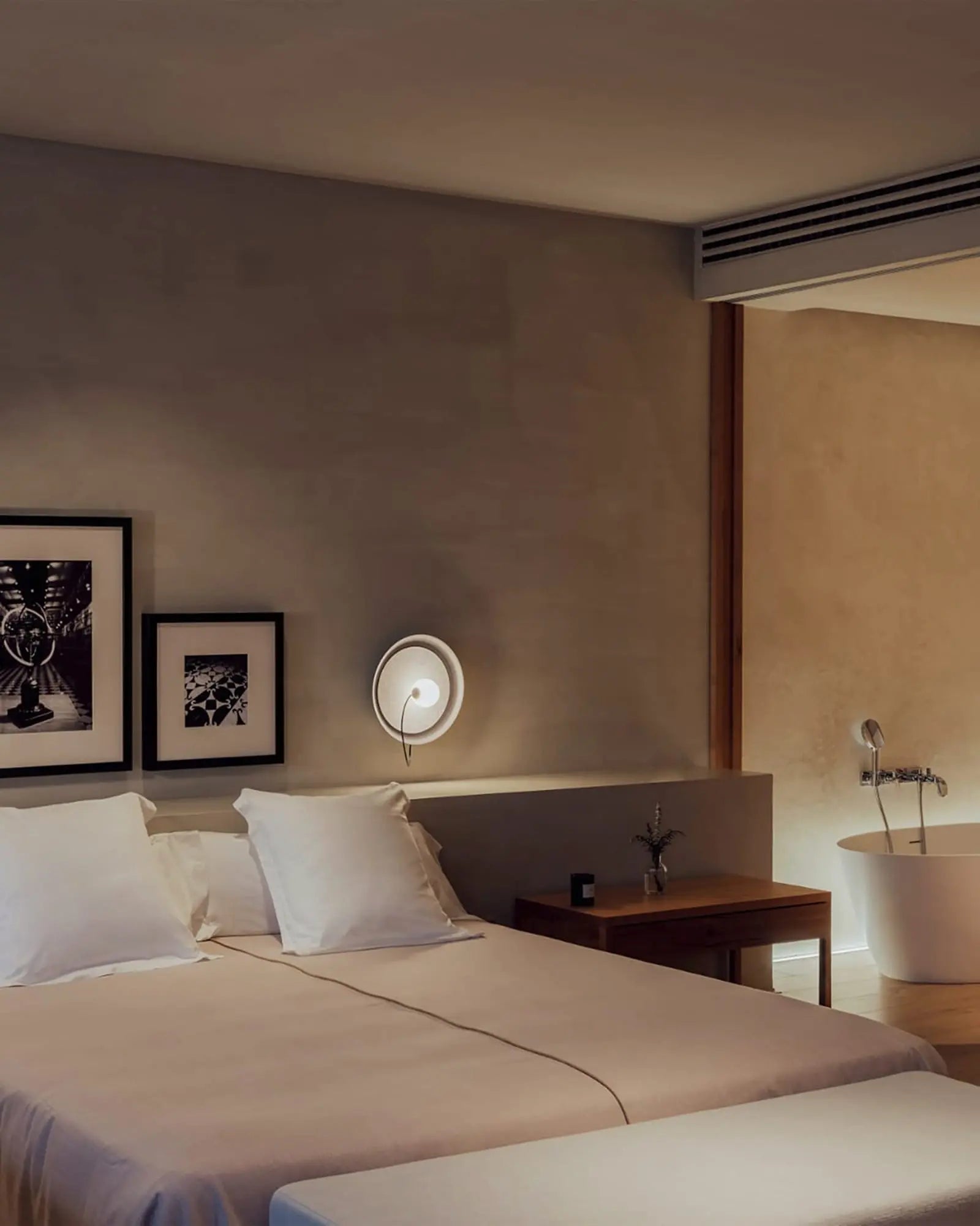 Wire wall light in a bedroom bedside