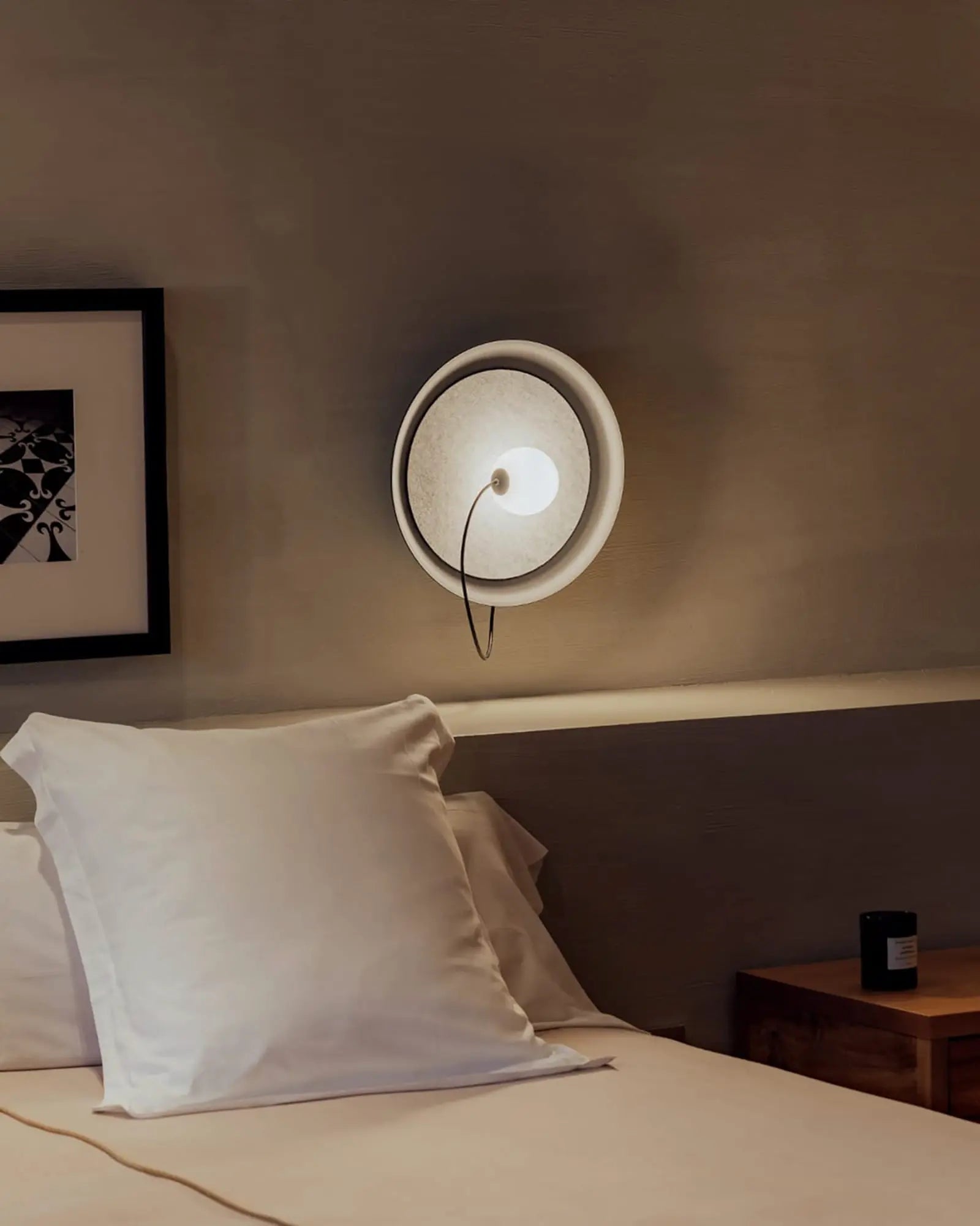 Wire wall light in a bedroom on the bedside