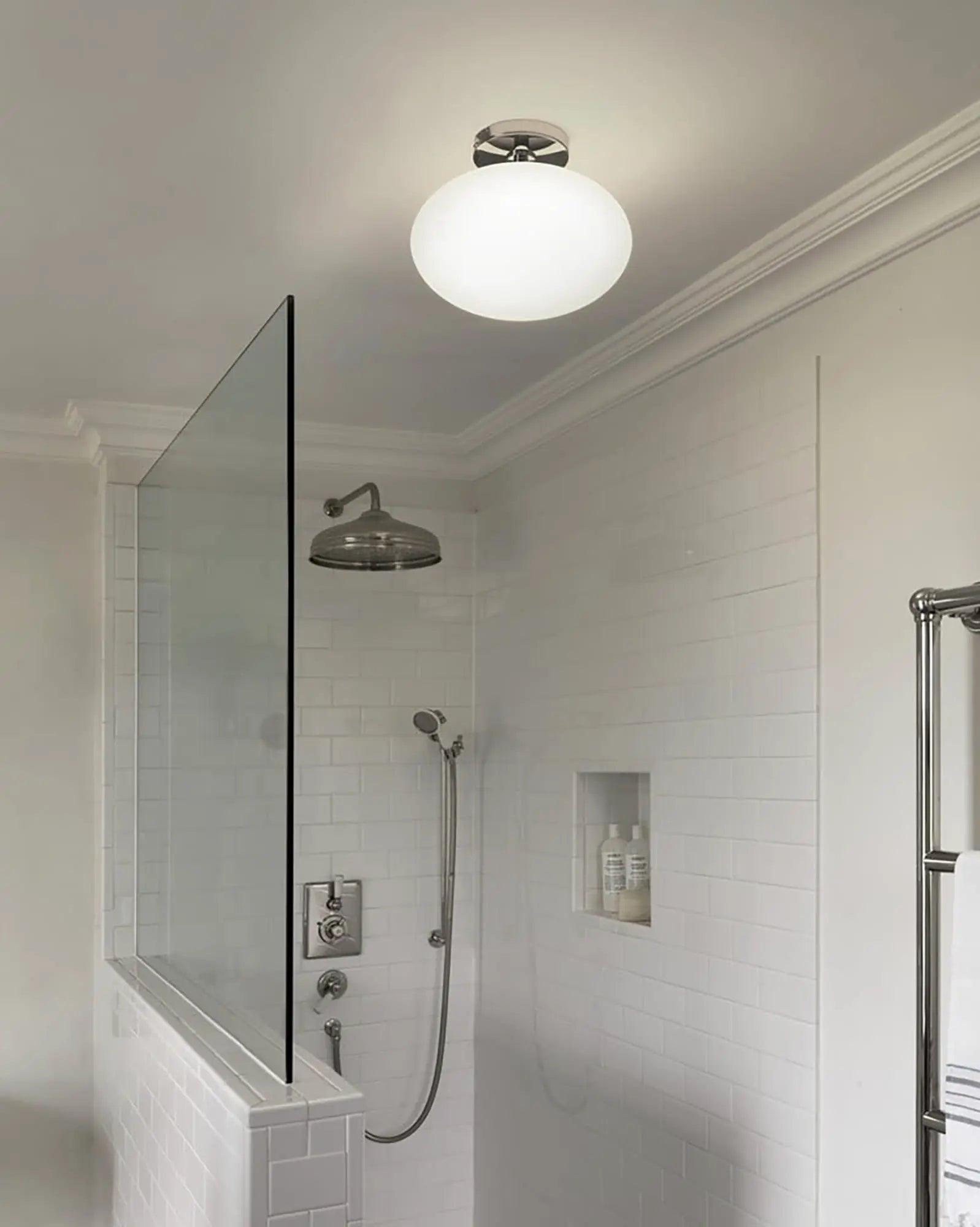 Zeppo orb glass ceiling light in a bathroom near a shower