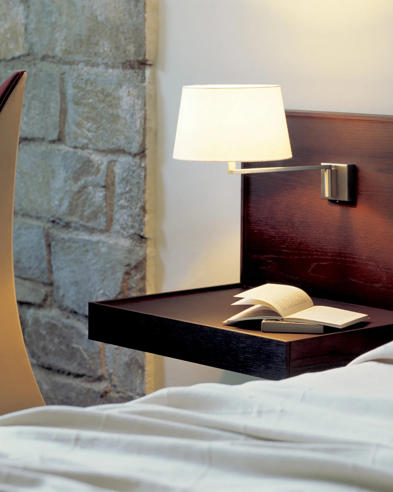 Americana Wall Light by Santa & Cole featured in a modern contemporary bedroom | Nook Collections