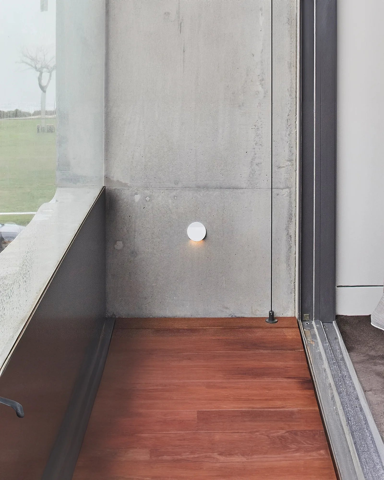 Featured step light the Avenir 060 T1 Wall Light by IILUS on a balcony with IP67 rating.