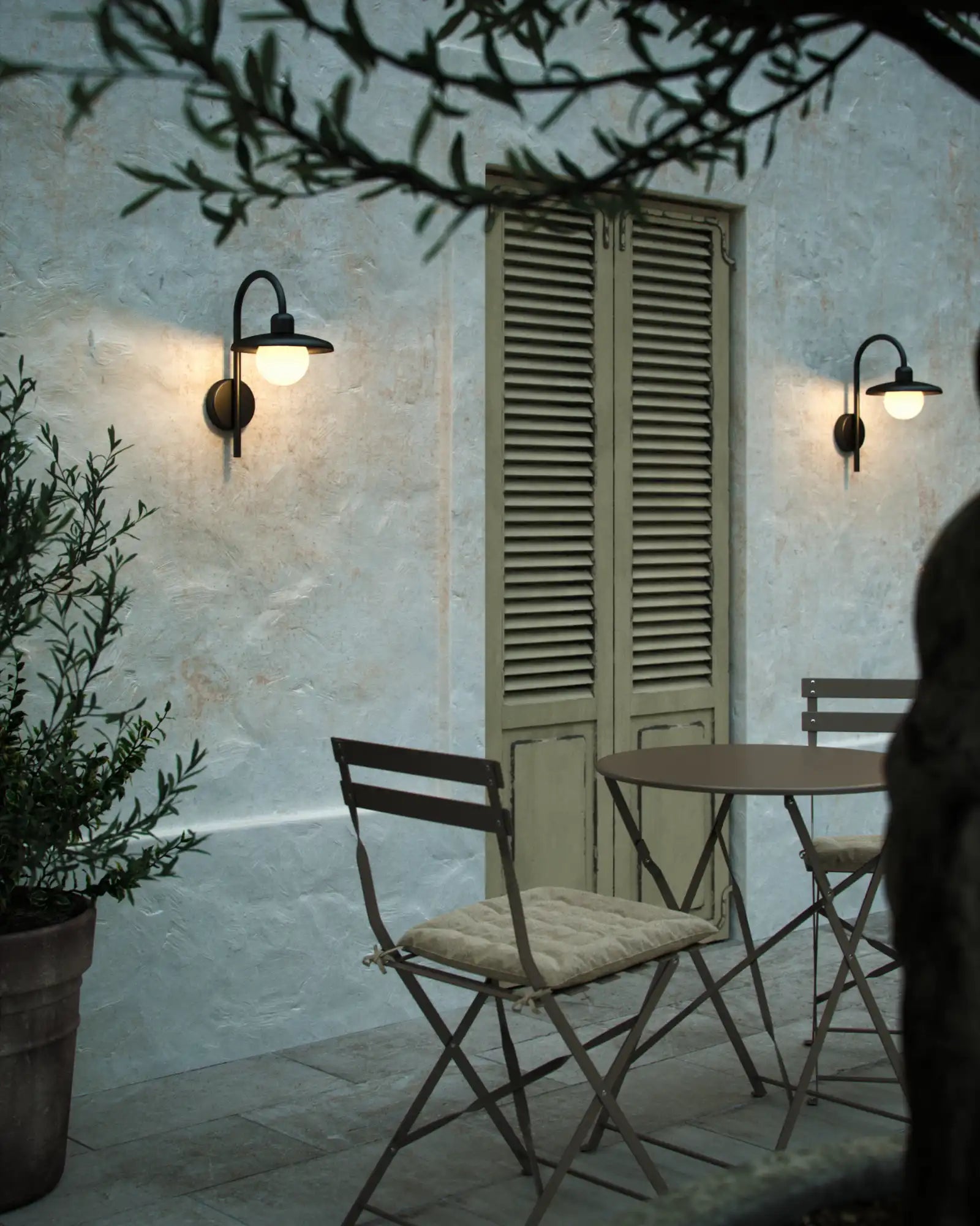 Berlo Wall Light by Nordlux Lighting featured in an outdoor lounge area | Nook Collections