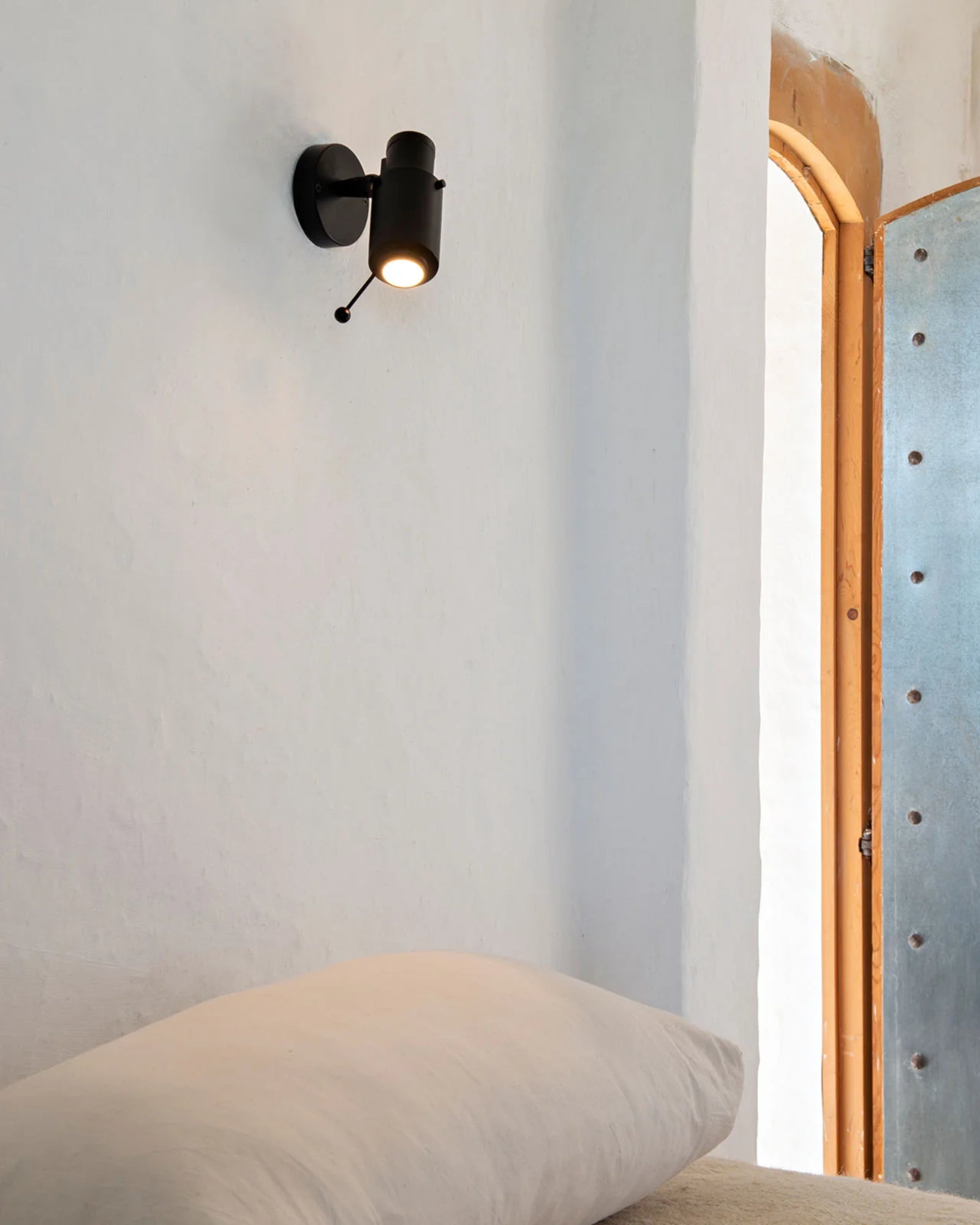 Biny Spot Wall Light by DCW Interiors featured in a modern contemporary bedroom | Nook Collections