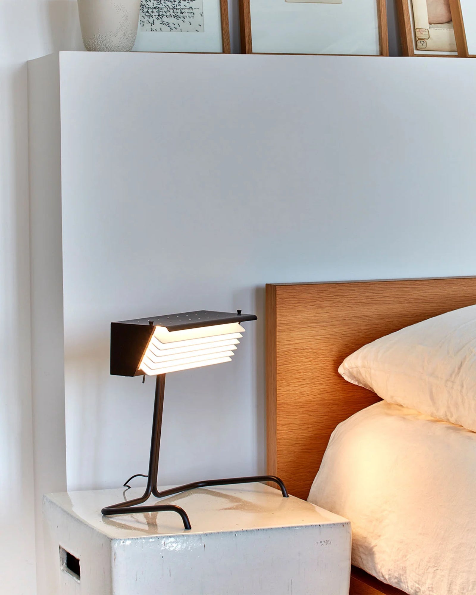 Biny Table Lamp by DCW Interiors featured in a modern contemporary bedroom | Nook Collections