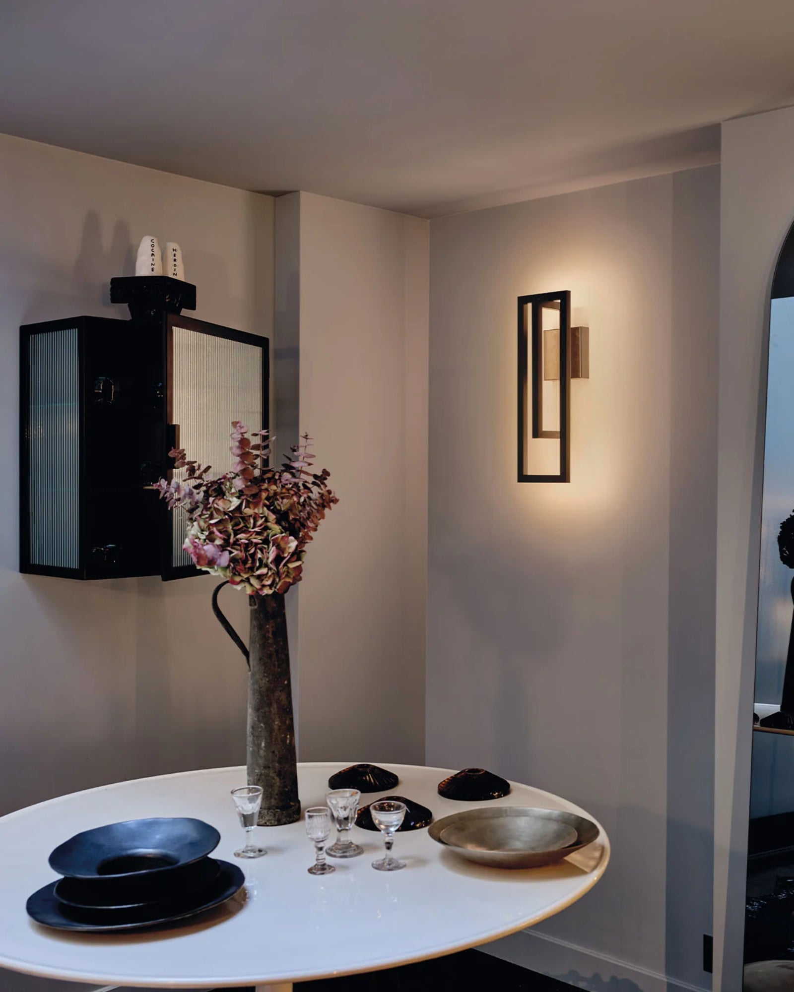 Borely Wall Light by DCW Interiors featured in a modern contemporary dining room | Nook Collections