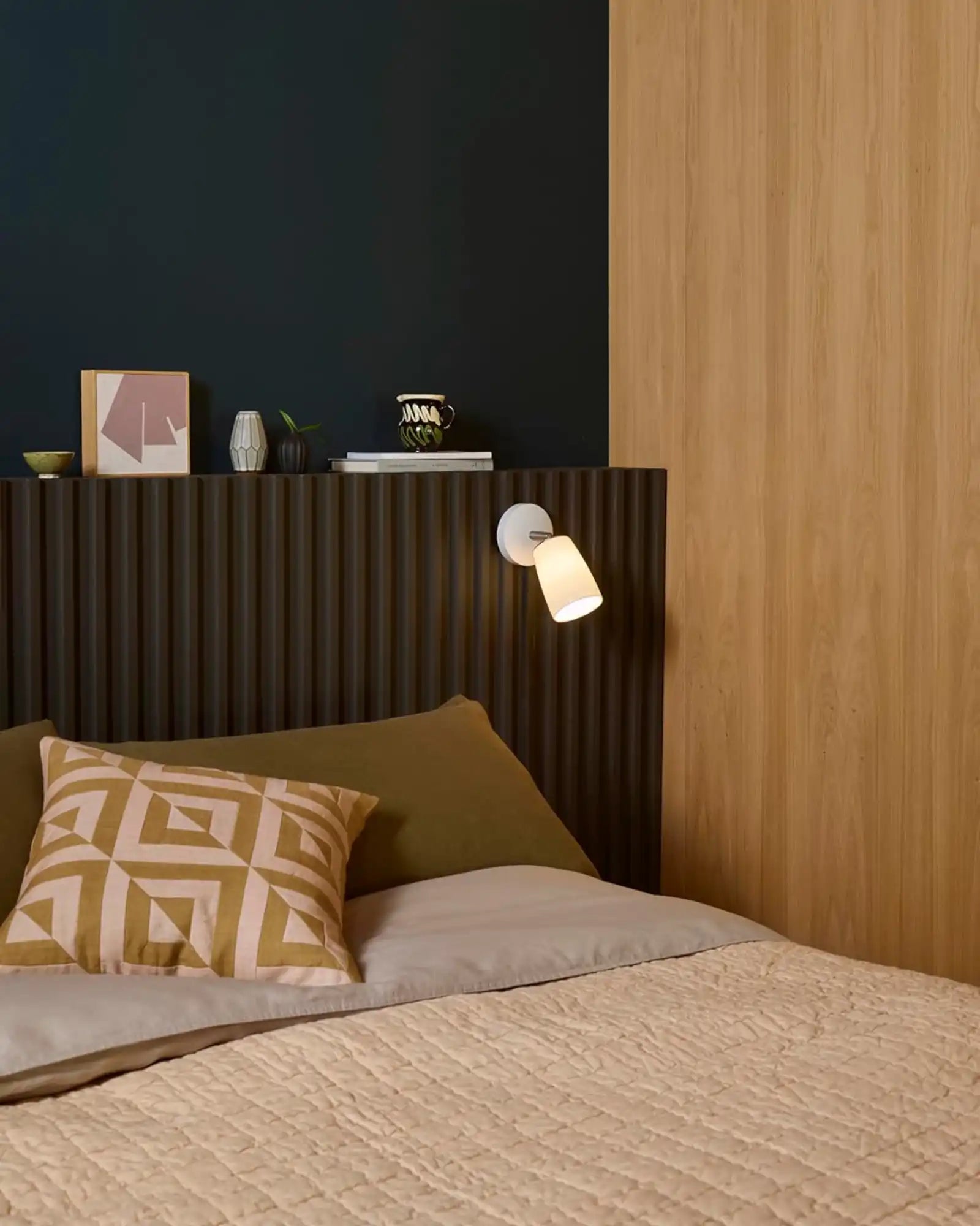 Carlton Wall Light by Astro Lighting featured within a modern contemporary bedroom | Nook Collections