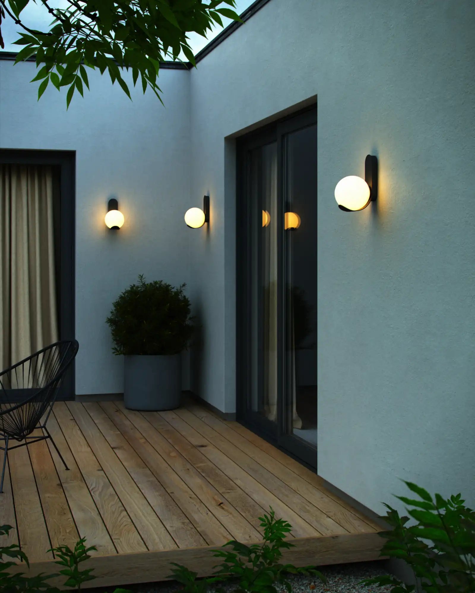 Dalius Wall Light by Nordlux Lighting featured in an outdoor lounge area | Nook Collections