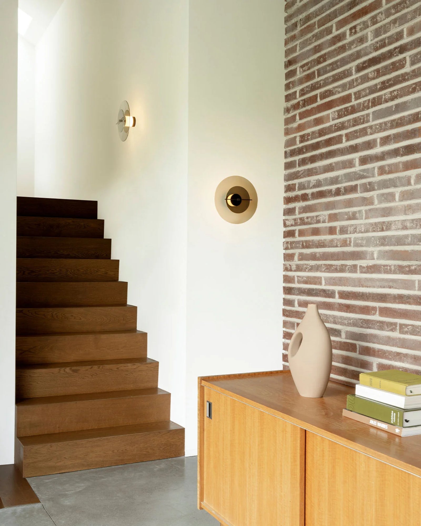 Delumina Wall Light by DCW Interiors featured in a scandinavian living room | Nook Collections