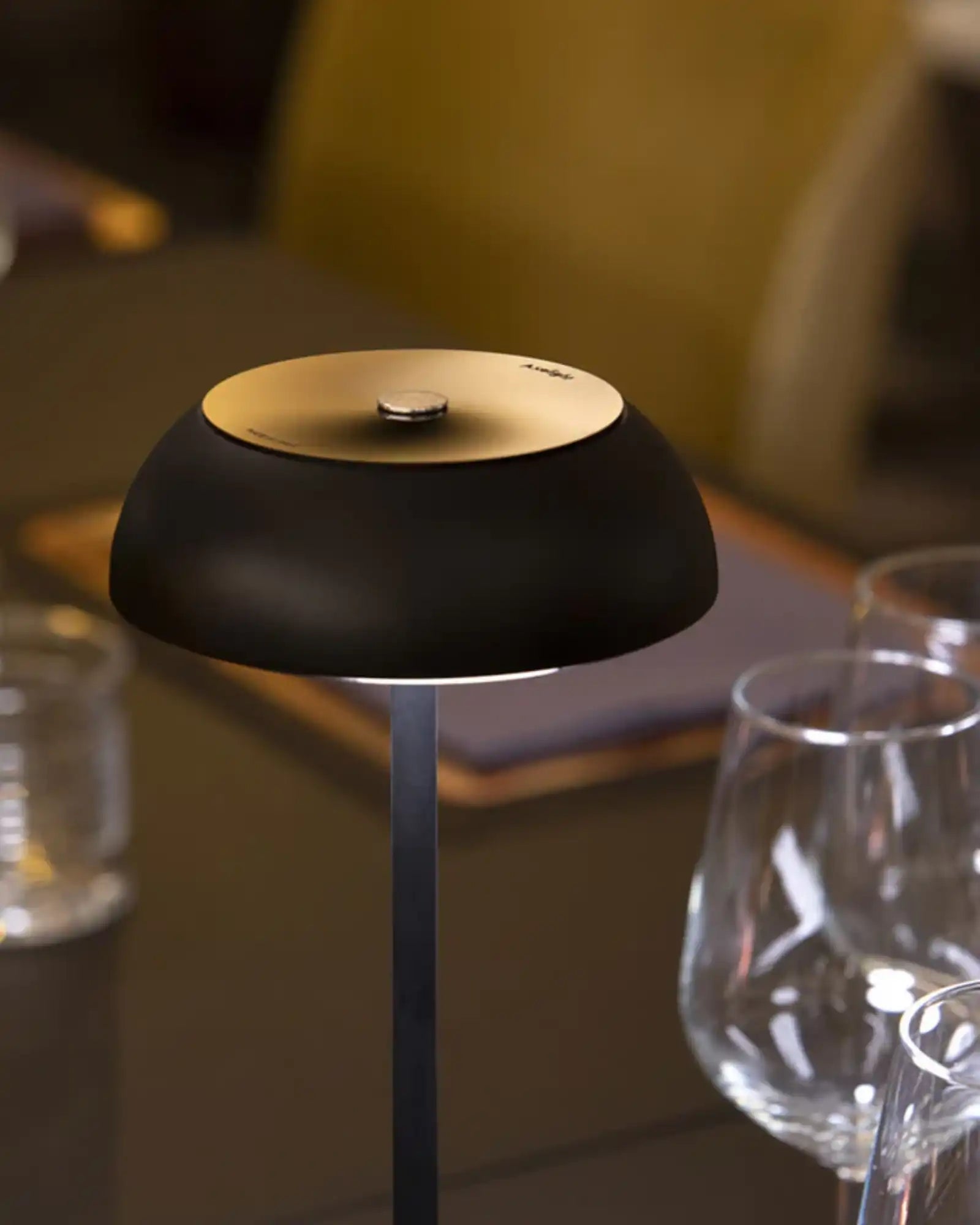 Float Table Lamp by Axolight featured in a modern contemporary restaurant | Nook Collections