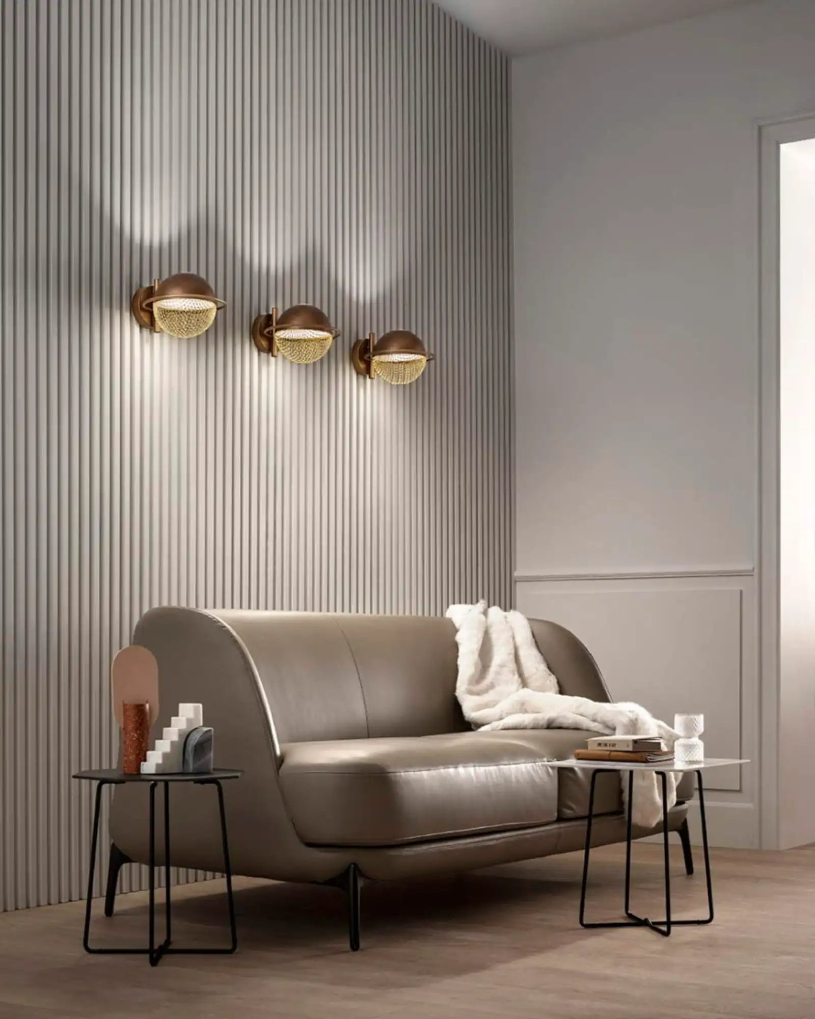 Iglu Wall Light by Masiero Lighting featured within a contemporary living room | Nook Collections