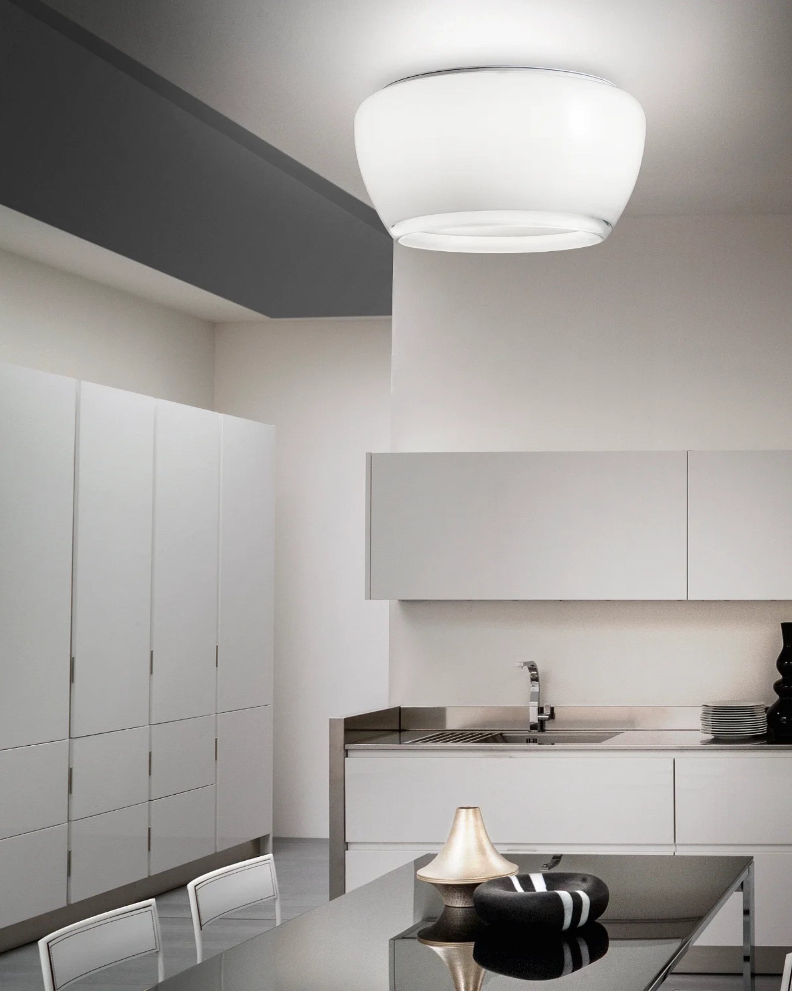 Implode Ceiling Light by Vistosi Lighting featured in a modern contemporary dining room | Nook Collections