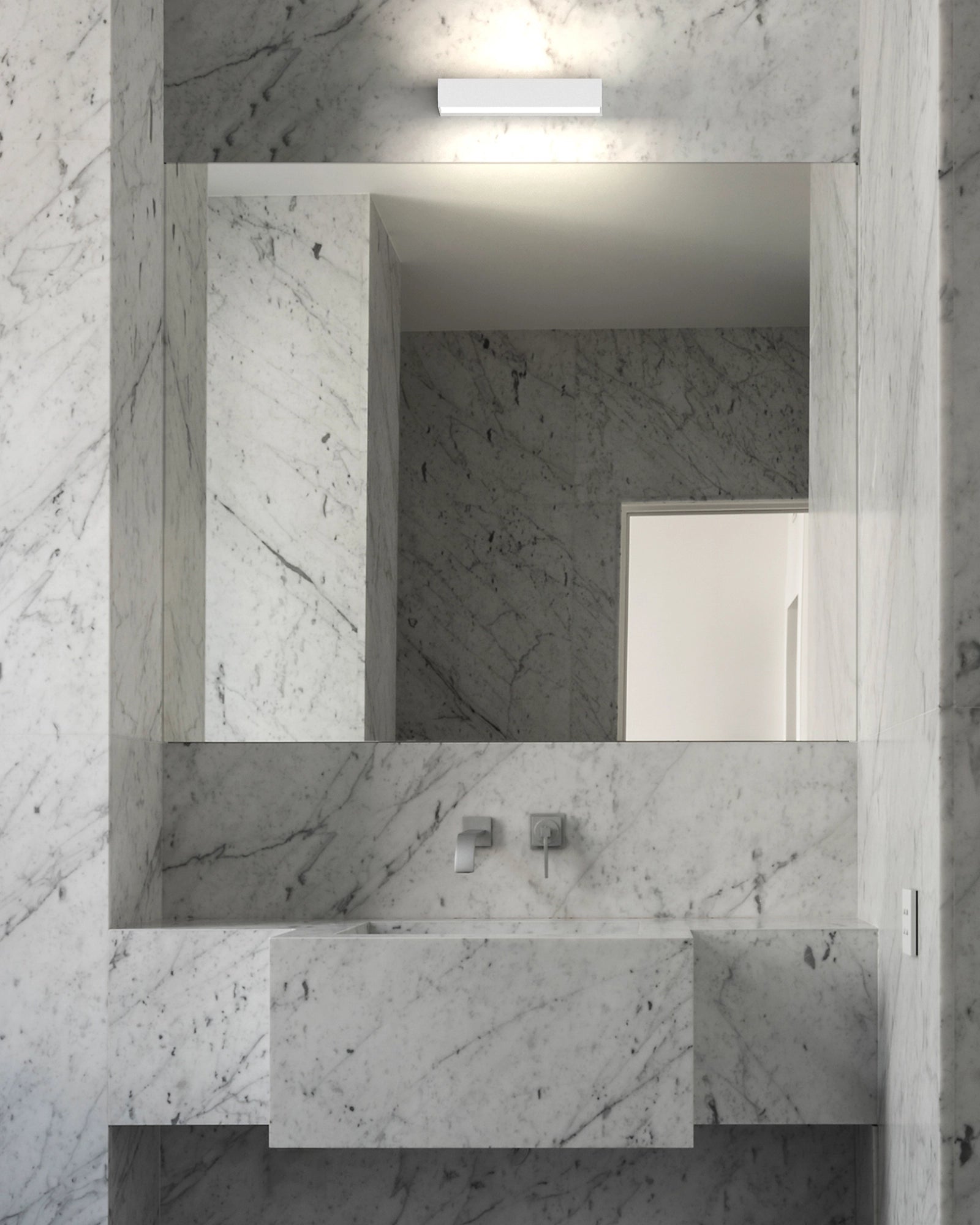 InOut Wall Light by Rotaliana featured in a modern contemporary bathroom | Nook Collections