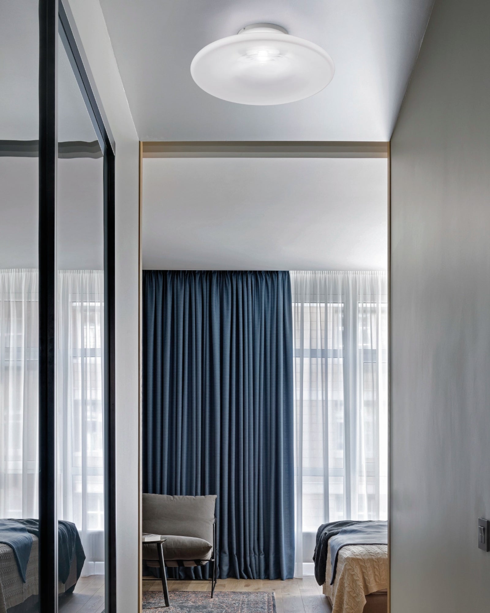 Incanto Ceiling Light by Vistosi Lighting featured in a modern contemporary bedroom | Nook Collections