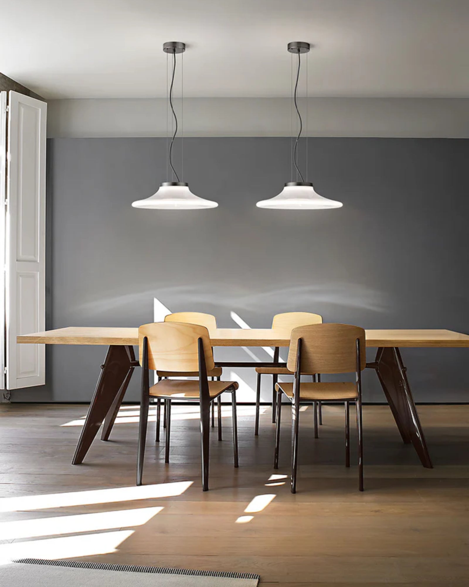 Incanto Pendant Light by Vistosi Lighting featured in a contemporary conference room | Nook Collections