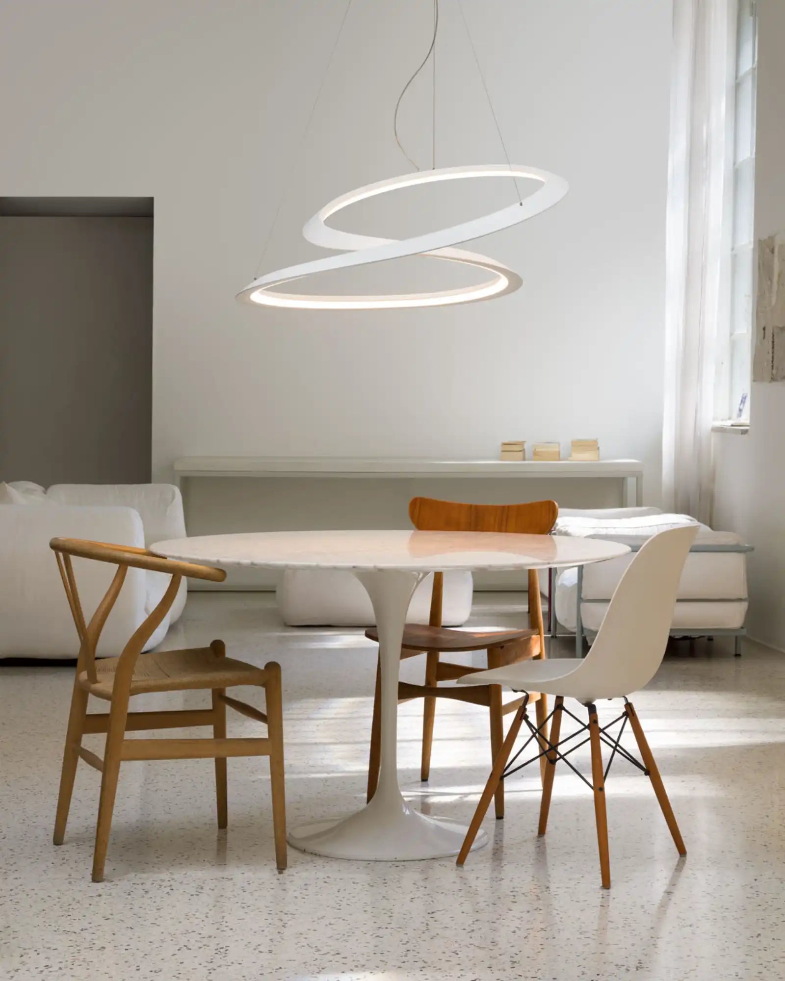 Kepler Minor Pendant Light by Nemo Lighting featured within a Scandinavian dining room | Nook Collections