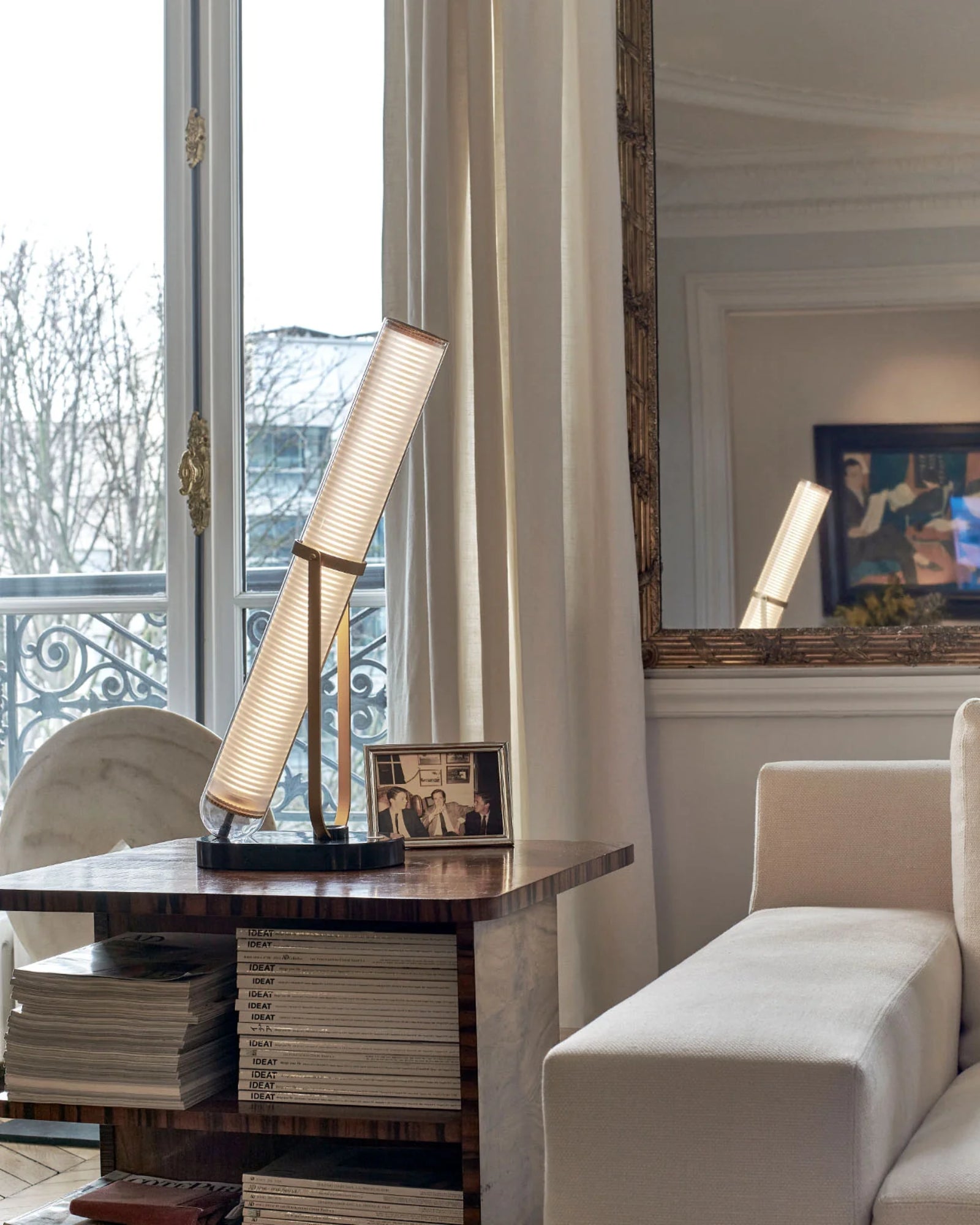 La Lampe Frechin Table Lamp by DCW Interiors featured in a modern contemporary living room | Nook Collections