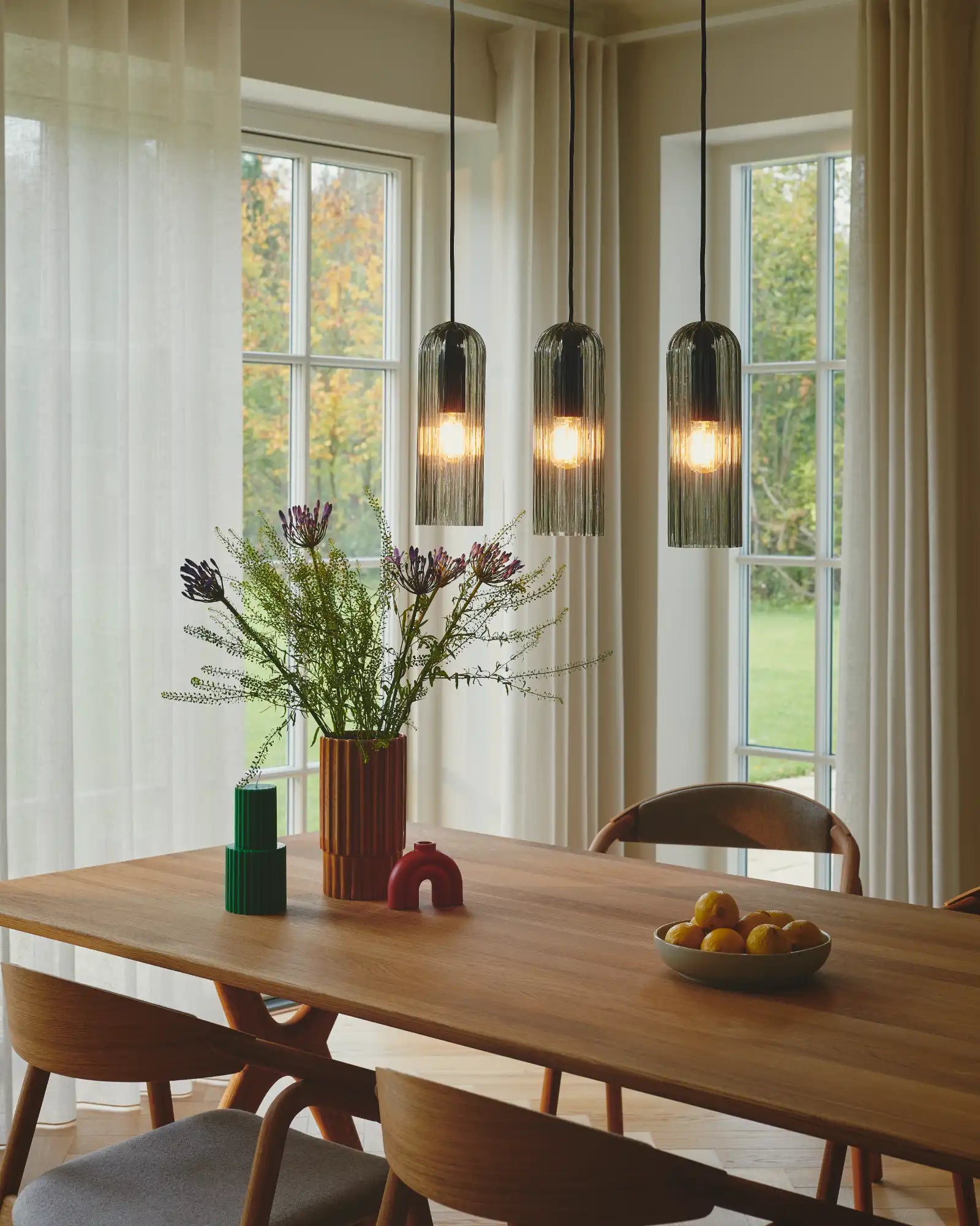 Miella 3lt Pendant Light by Nordlux Lighting featured within a contemporary dining room | Nook Collections