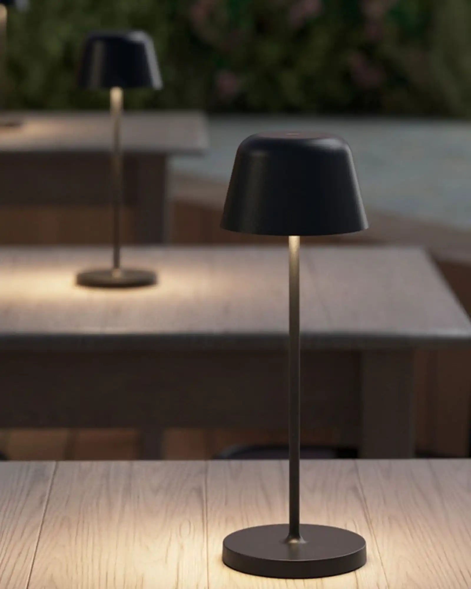 Nomad Portable Table Lamp by Astro Lighting featured in a library | Nook Collections