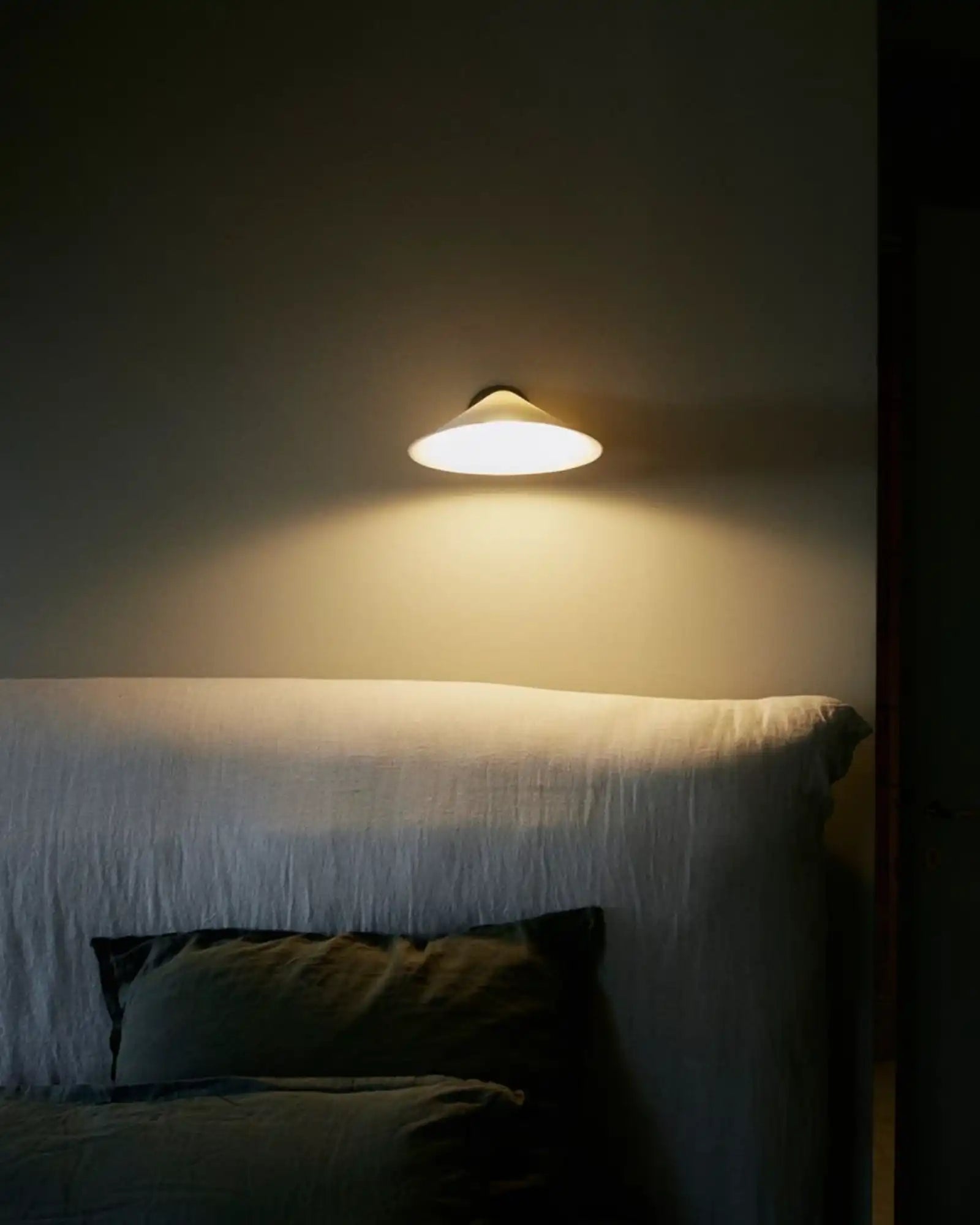 Plume Wall Light by DCW Editions featured within a contemporary bedroom | Nook Collections